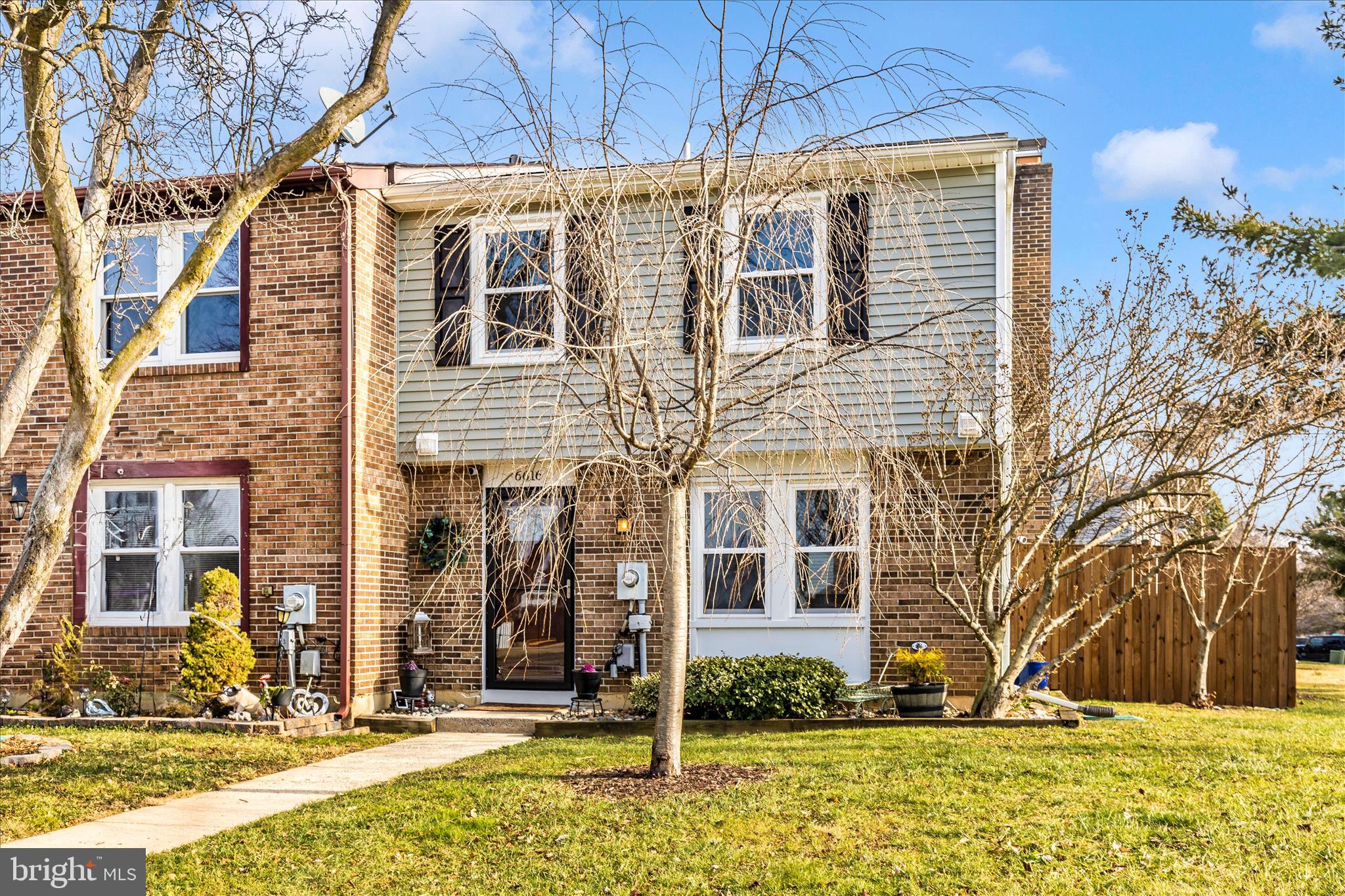 6616 Pebble Court Frederick, MD 21703 - Photo 24 of 33 a view of a brick house with a yard