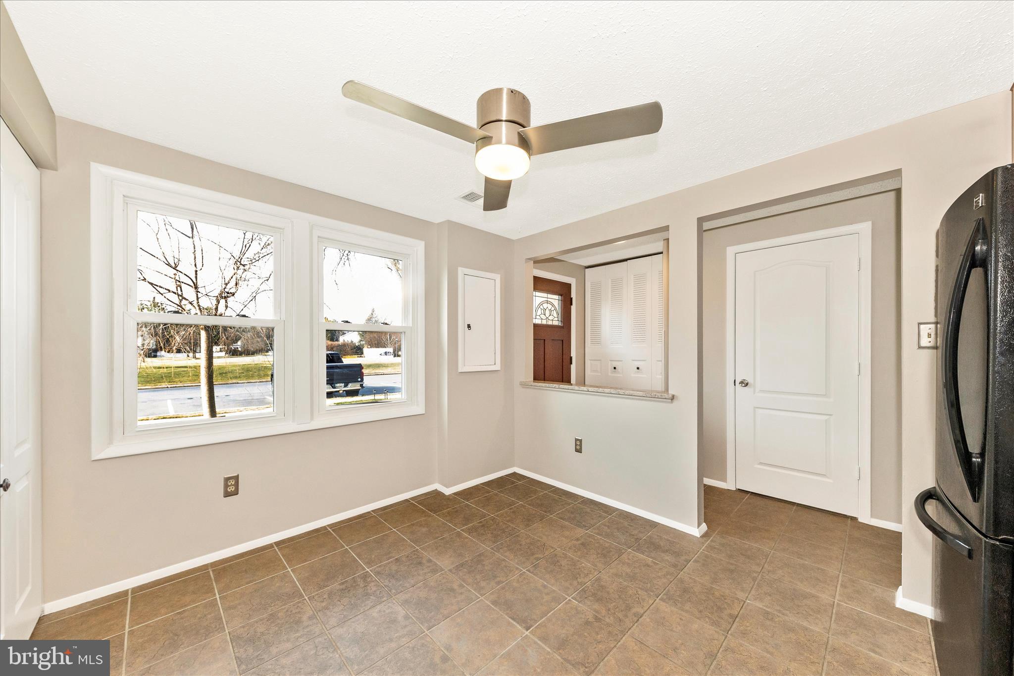 6616 Pebble Court Frederick, MD 21703 - Photo 3 of 33 a view of an empty room with a window