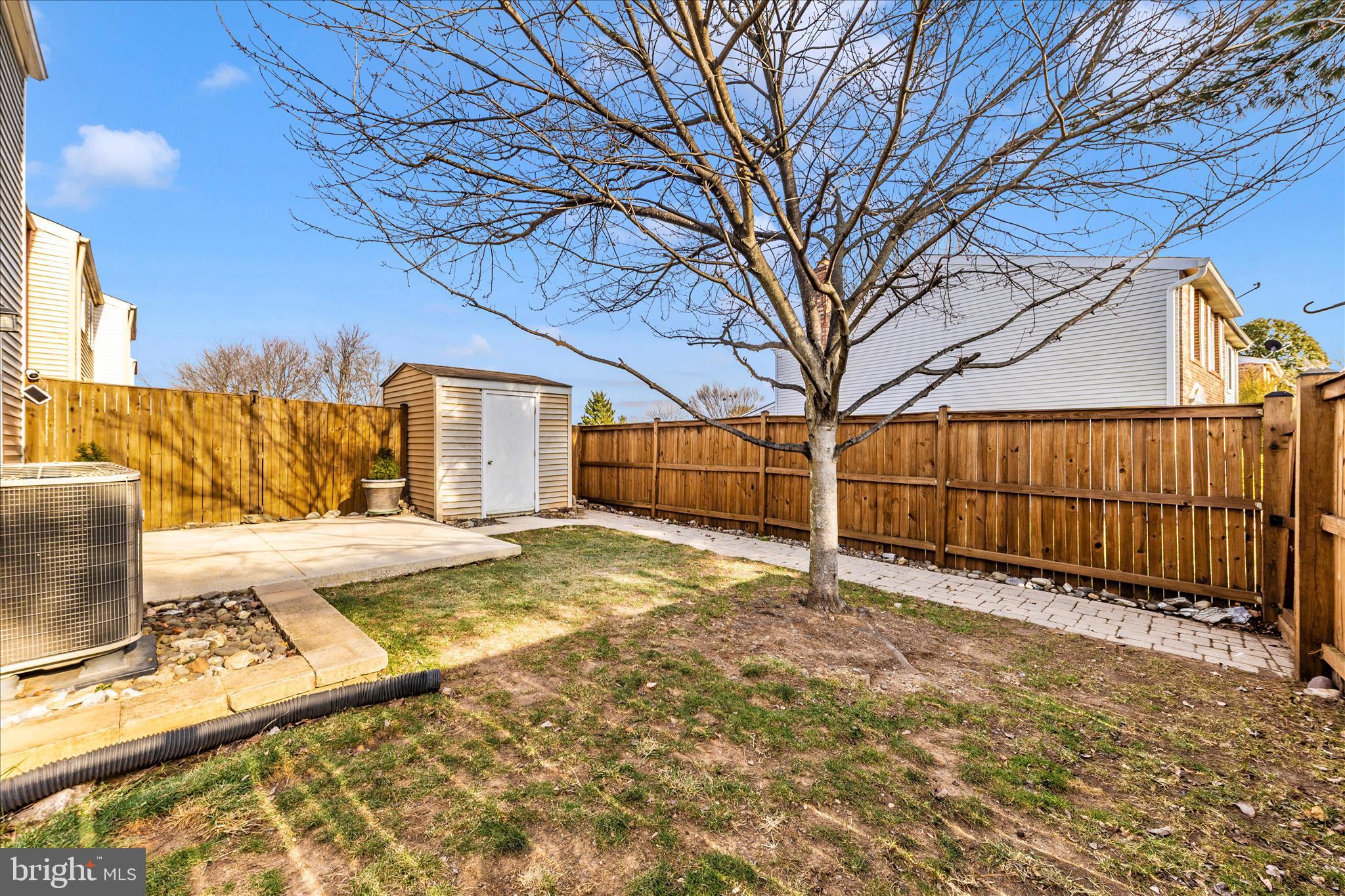 6616 Pebble Court Frederick, MD 21703 - Photo 31 of 33 a view of a backyard with wooden fence