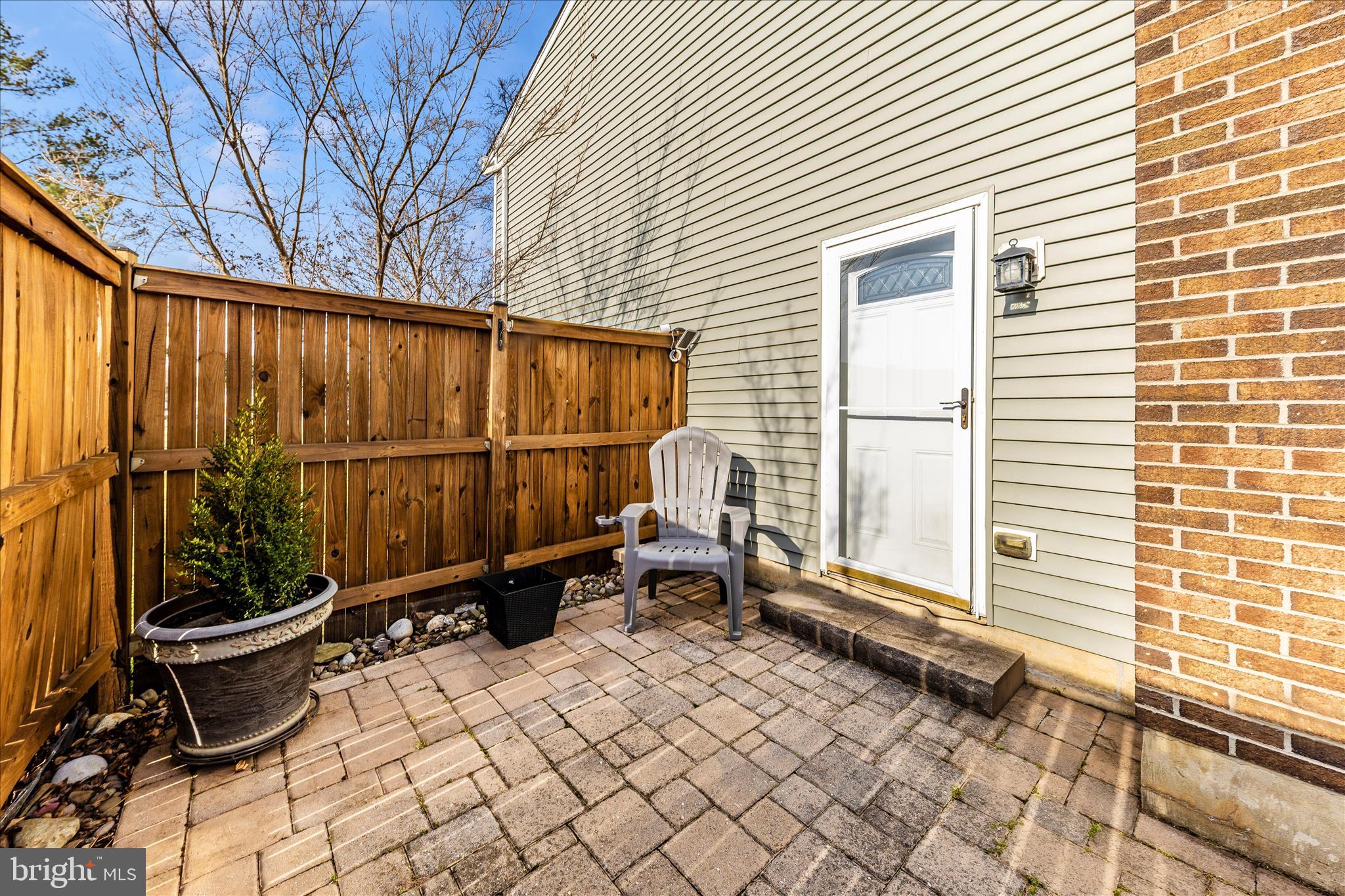 6616 Pebble Court Frederick, MD 21703 - Photo 32 of 33 a backyard of a house with yard and outdoor seating