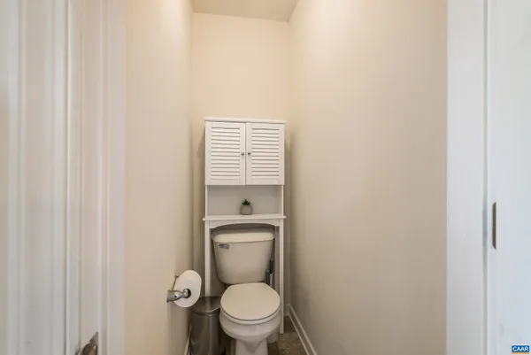 a bathroom with a toilet and a sink