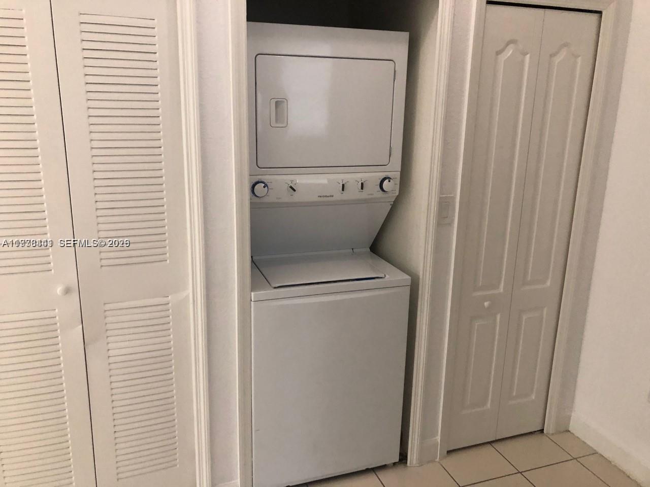 2925 Southeast 16th Avenue, Unit 202 Homestead, FL 33035 - Photo 6 of 11 a utility room with dryer and washer