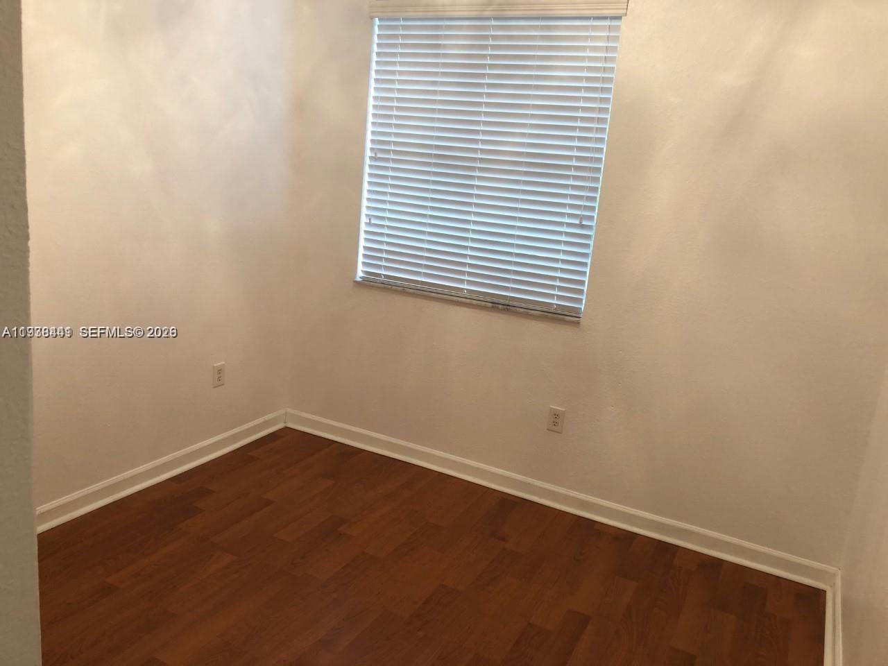 2925 Southeast 16th Avenue, Unit 202 Homestead, FL 33035 - Photo 9 of 11 an empty room with a window