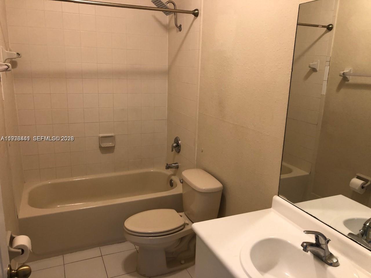 2925 Southeast 16th Avenue, Unit 202 Homestead, FL 33035 - Photo 10 of 11 a bathroom with a sink toilet and shower
