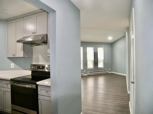 a kitchen with a stove and a refrigerator