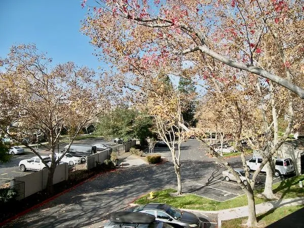 a couple of cars parked in front of a house