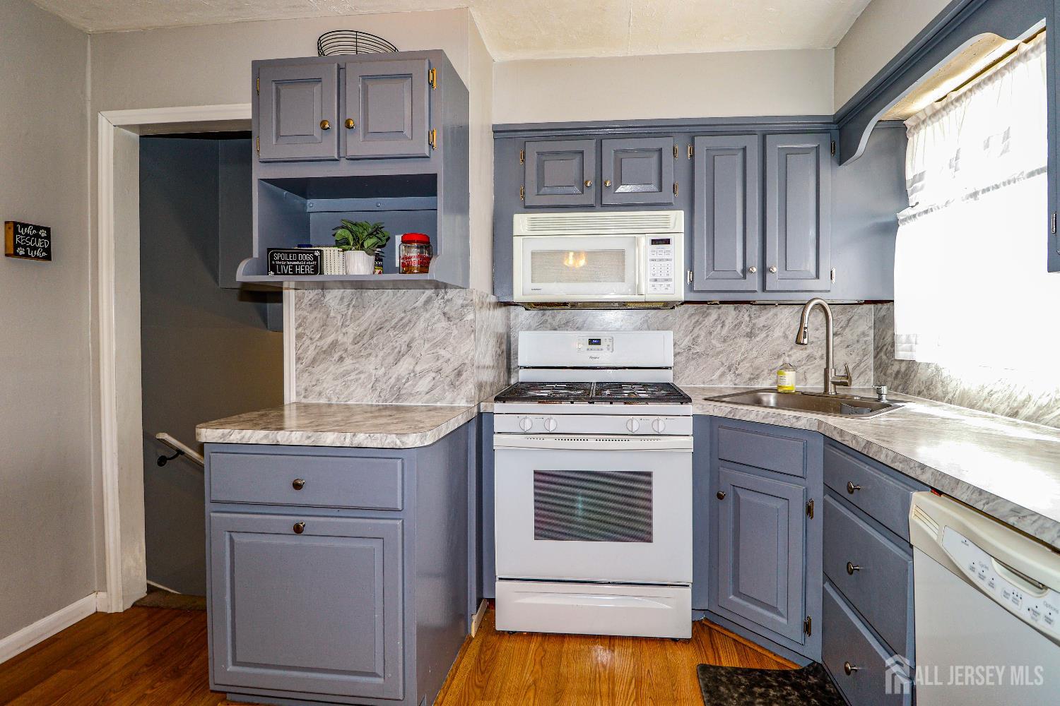 26 Moryan Road Edison, NJ 08817 - Photo 13 of 32 a kitchen with stainless steel appliances granite countertop a stove and cabinets