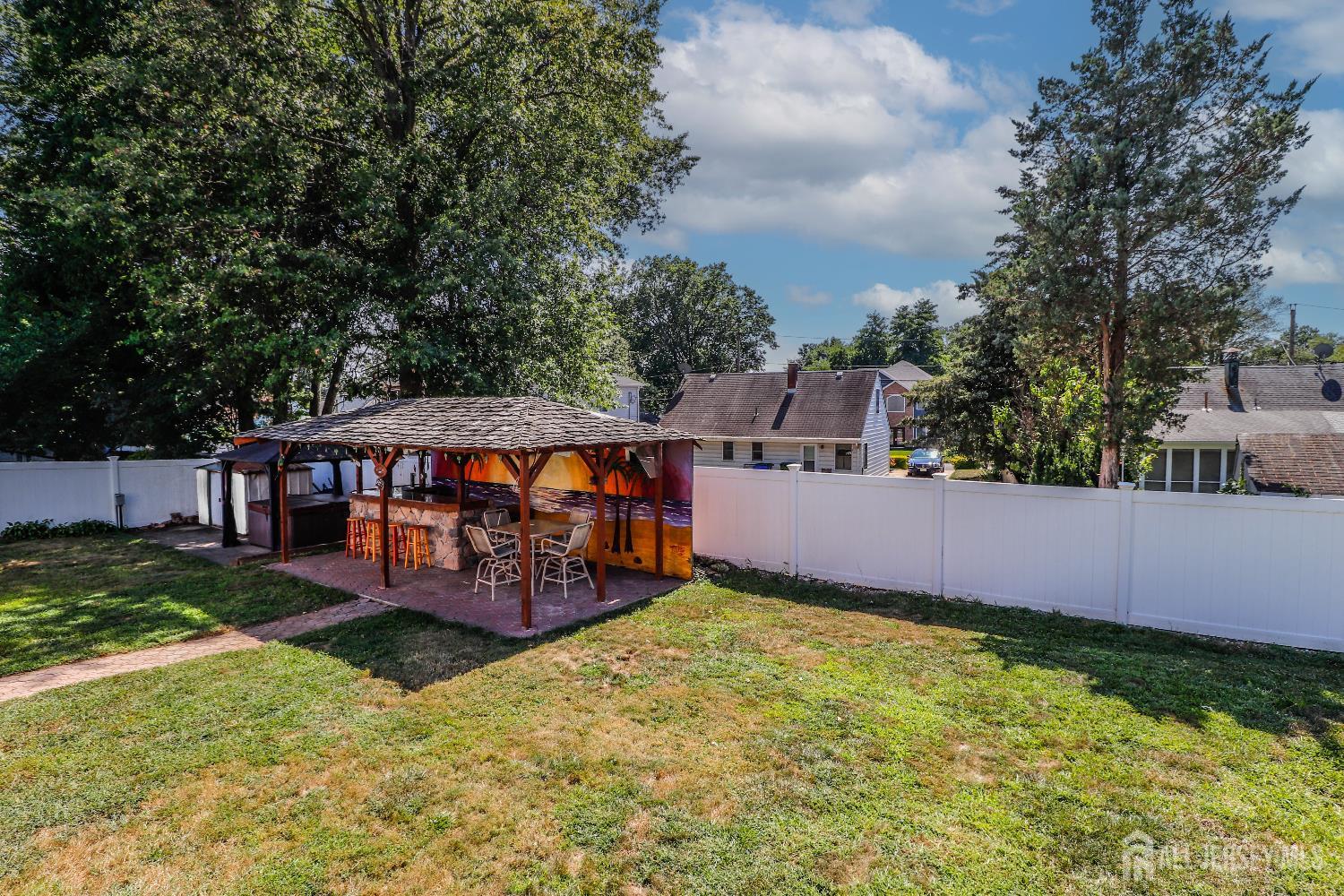 26 Moryan Road Edison, NJ 08817 - Photo 28 of 32 a view of a house with a yard and sitting area