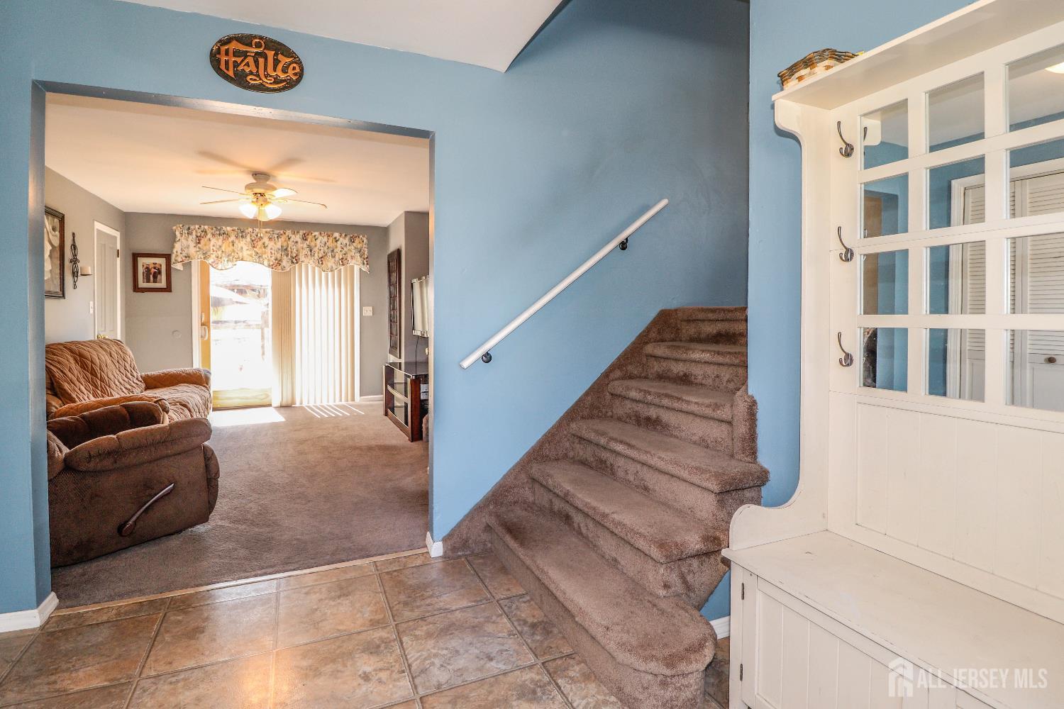 26 Moryan Road Edison, NJ 08817 - Photo 5 of 32 a view of a livingroom with furniture and staircase