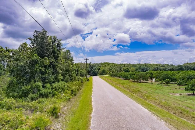 a view of a lake with a yard