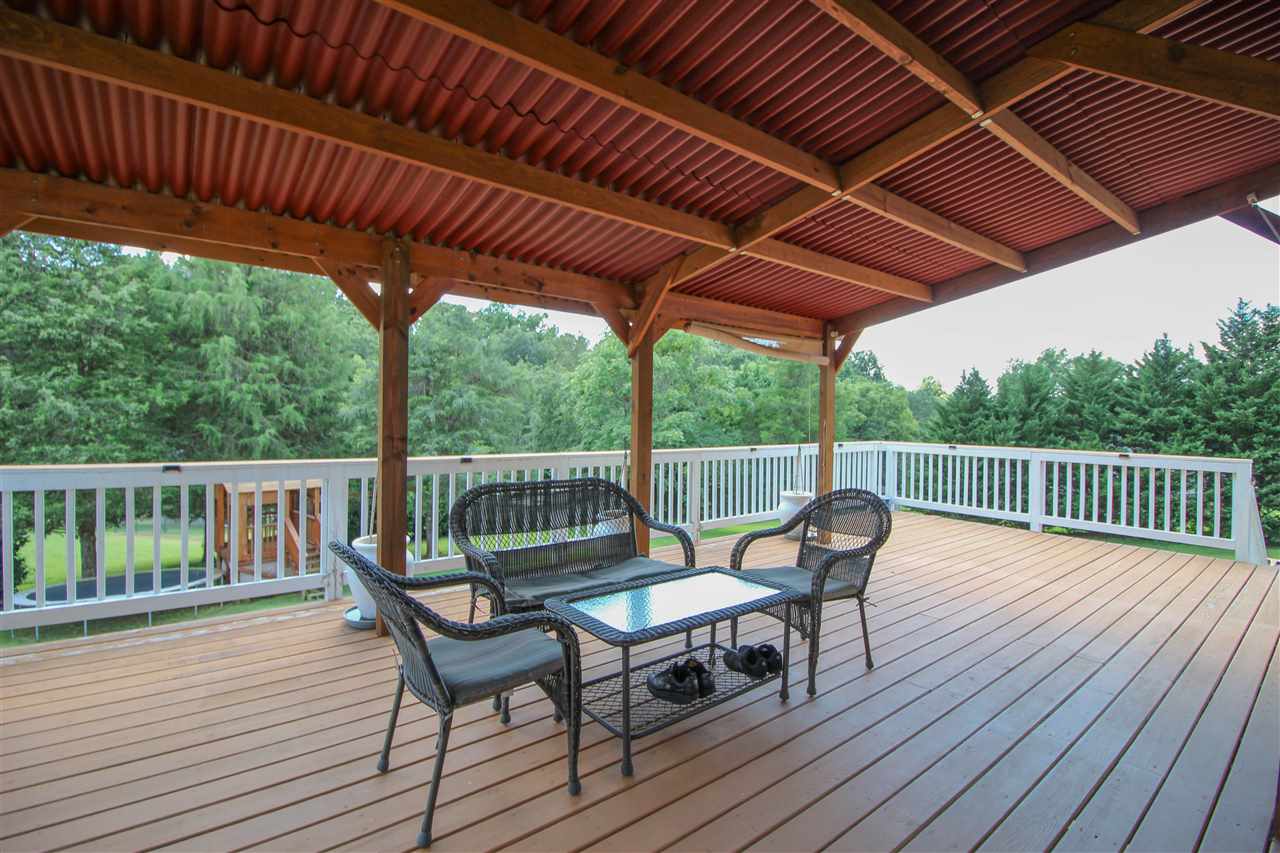 5146 Amicus Road Ruckersville, VA 22968 - Photo 17 of 23 a view of a chairs on wooden deck