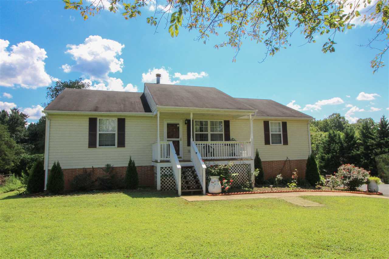 5146 Amicus Road Ruckersville, VA 22968 - Photo 2 of 23 a front view of a house with a yard and garage