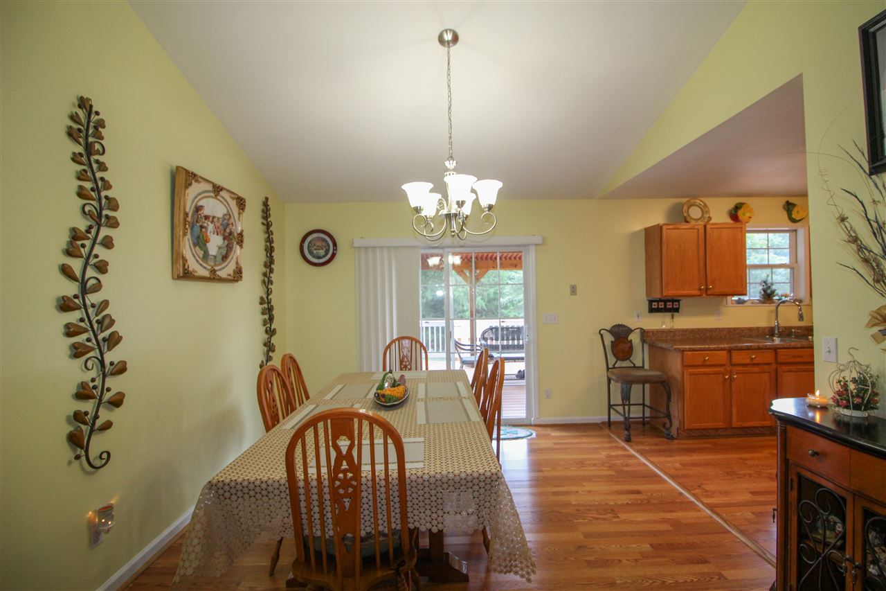 5146 Amicus Road Ruckersville, VA 22968 - Photo 6 of 23 a view of a dining room with furniture window and wooden floor