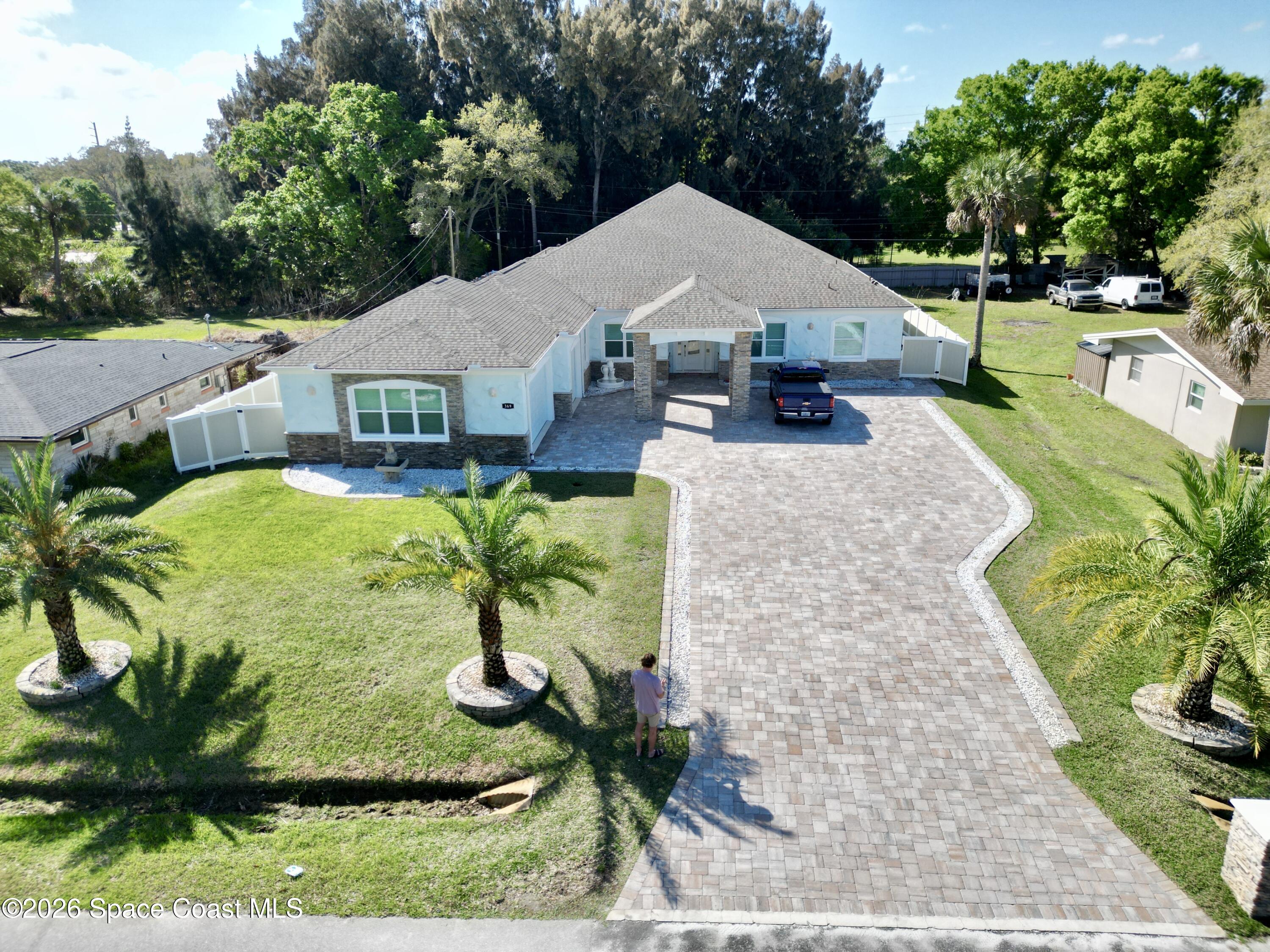 369 Tolley Avenue Melbourne, FL 32934 - Photo 1 of 33 a aerial view of a house with a yard patio and deck