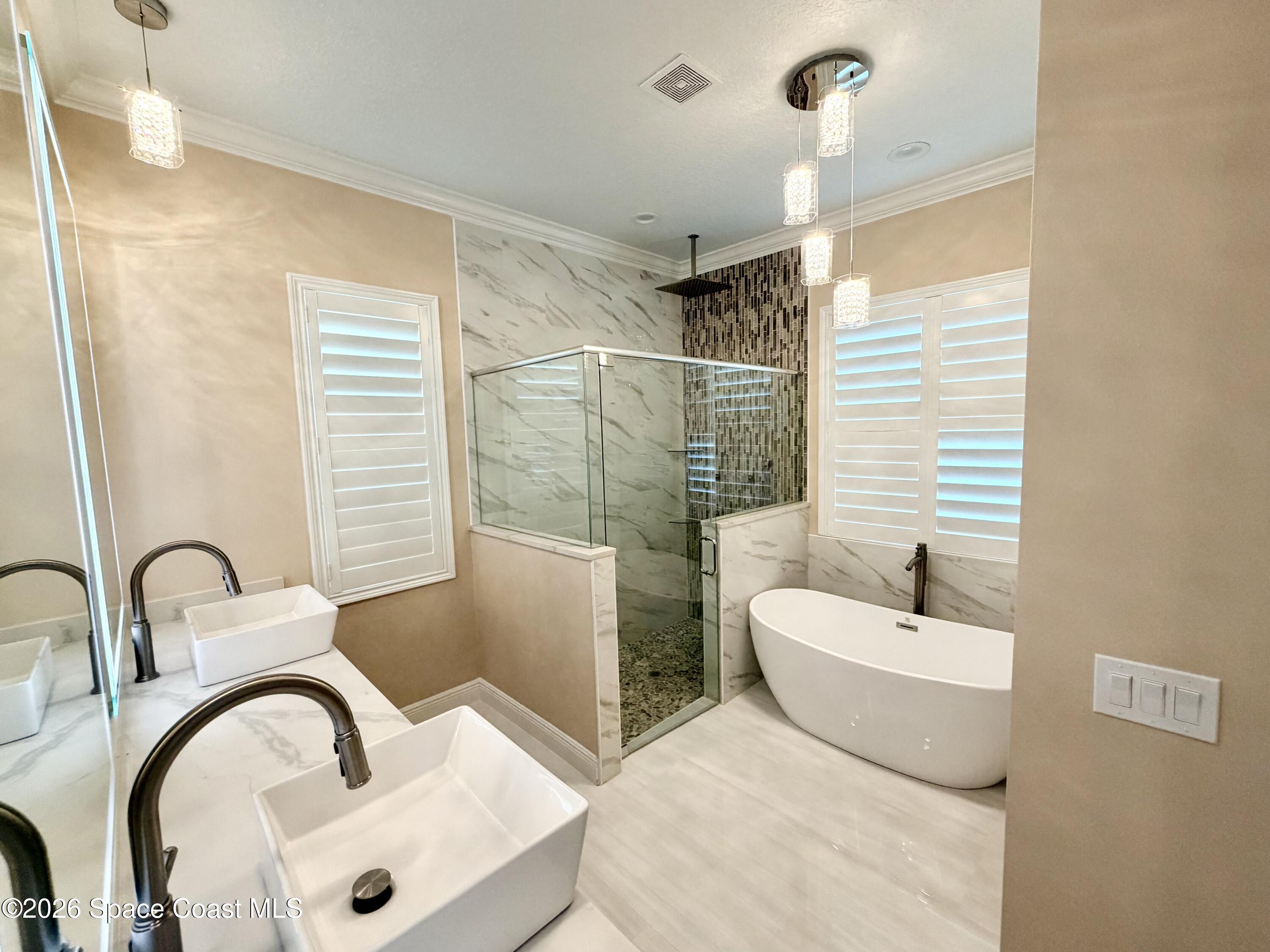 369 Tolley Avenue Melbourne, FL 32934 - Photo 14 of 33 a bathroom with a sink and a mirror