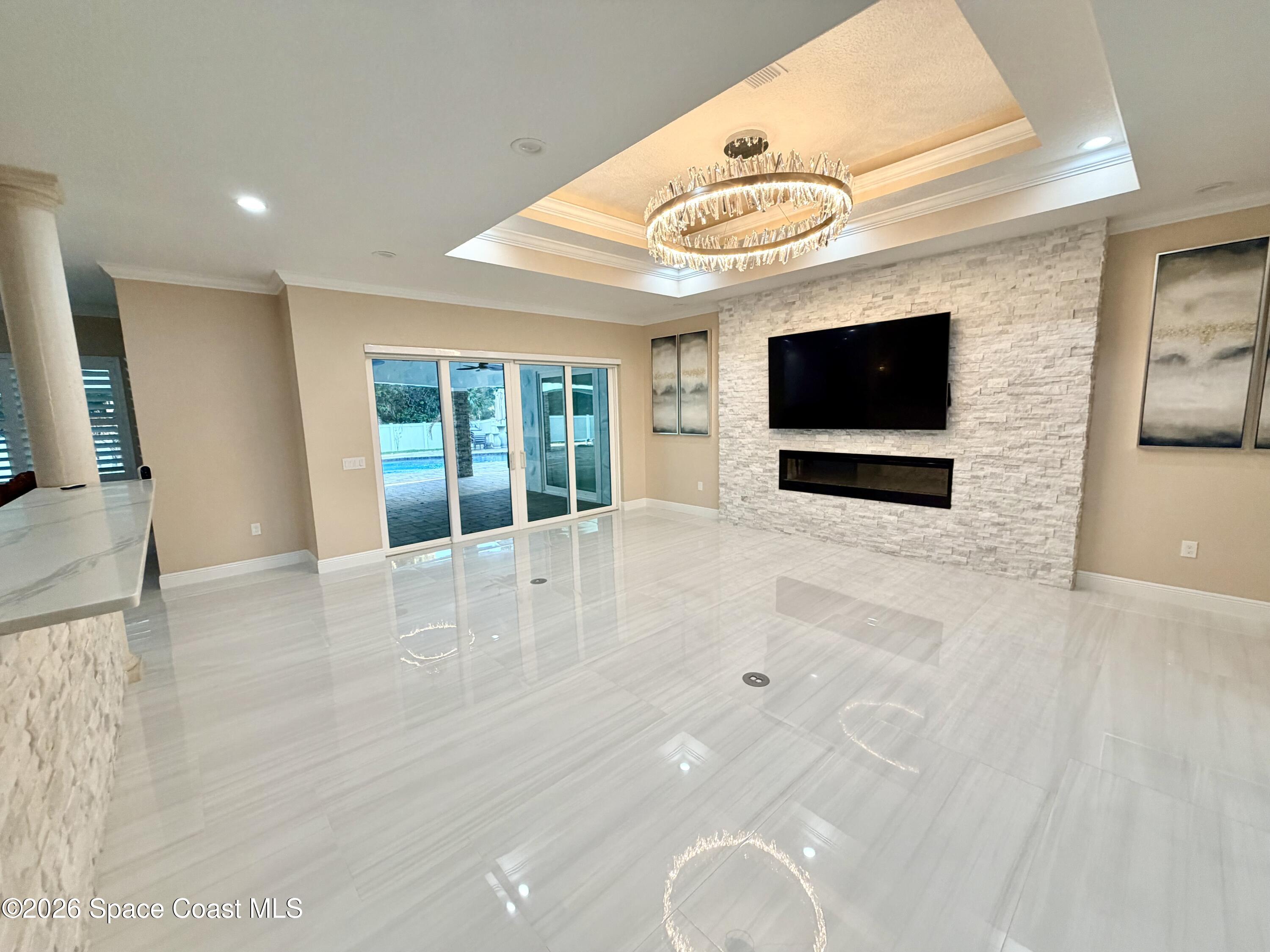 369 Tolley Avenue Melbourne, FL 32934 - Photo 5 of 33 a view of a livingroom with a flat screen tv
