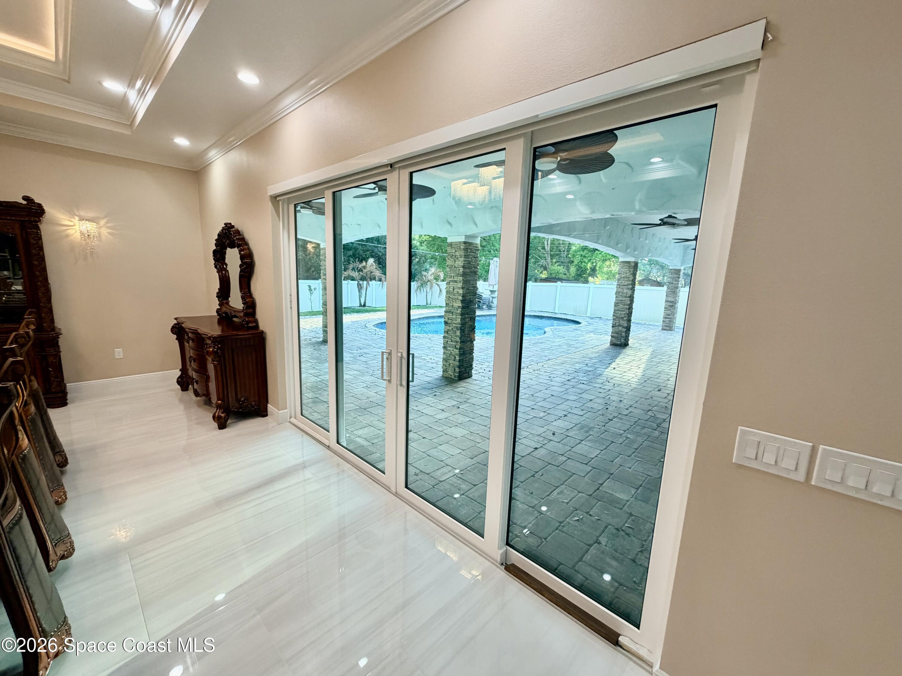 369 Tolley Avenue Melbourne, FL 32934 - Photo 8 of 33 a view of a hallway with windows