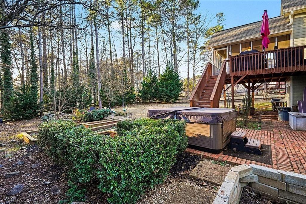 1164 Amberton Lane Powder Springs, GA 30127 - Photo 34 of 43 a view of an outdoor sitting area with couch and wooden fence