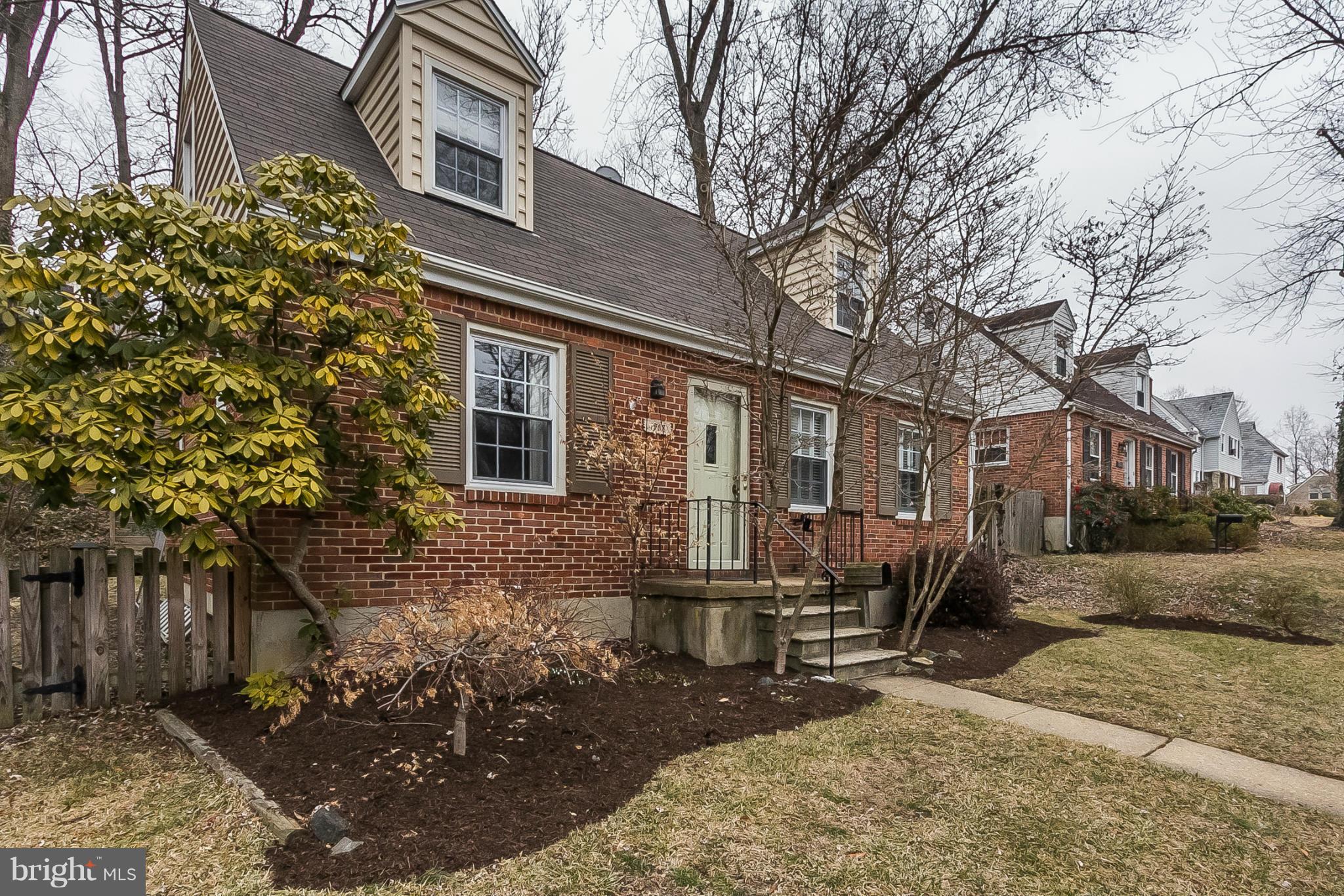 1908 Fairbank Road Baltimore, MD 21209 - Photo 1 of 27 a view of a house with a yard and sitting area