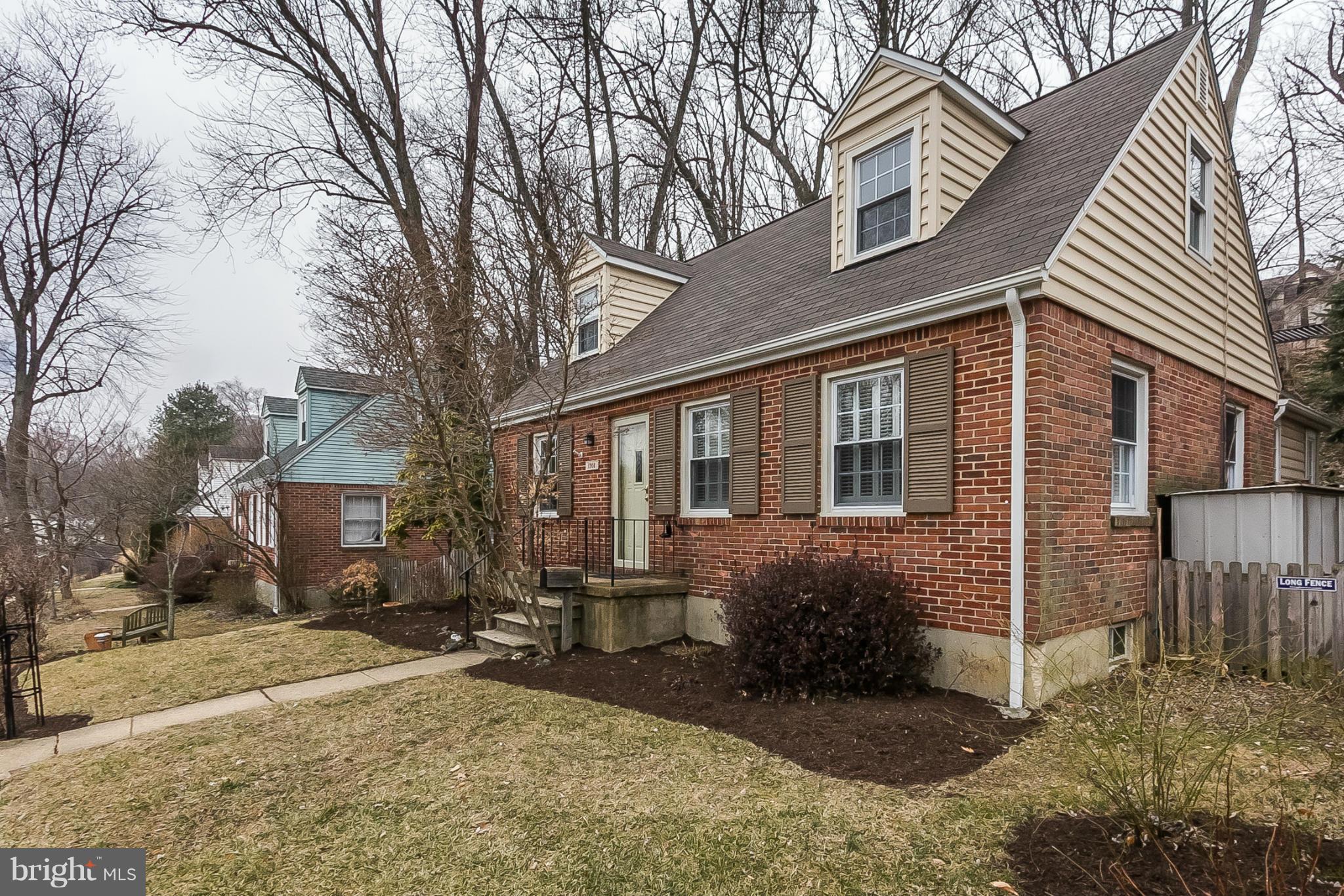 1908 Fairbank Road Baltimore, MD 21209 - Photo 2 of 27 a view of a house with a yard and large tree