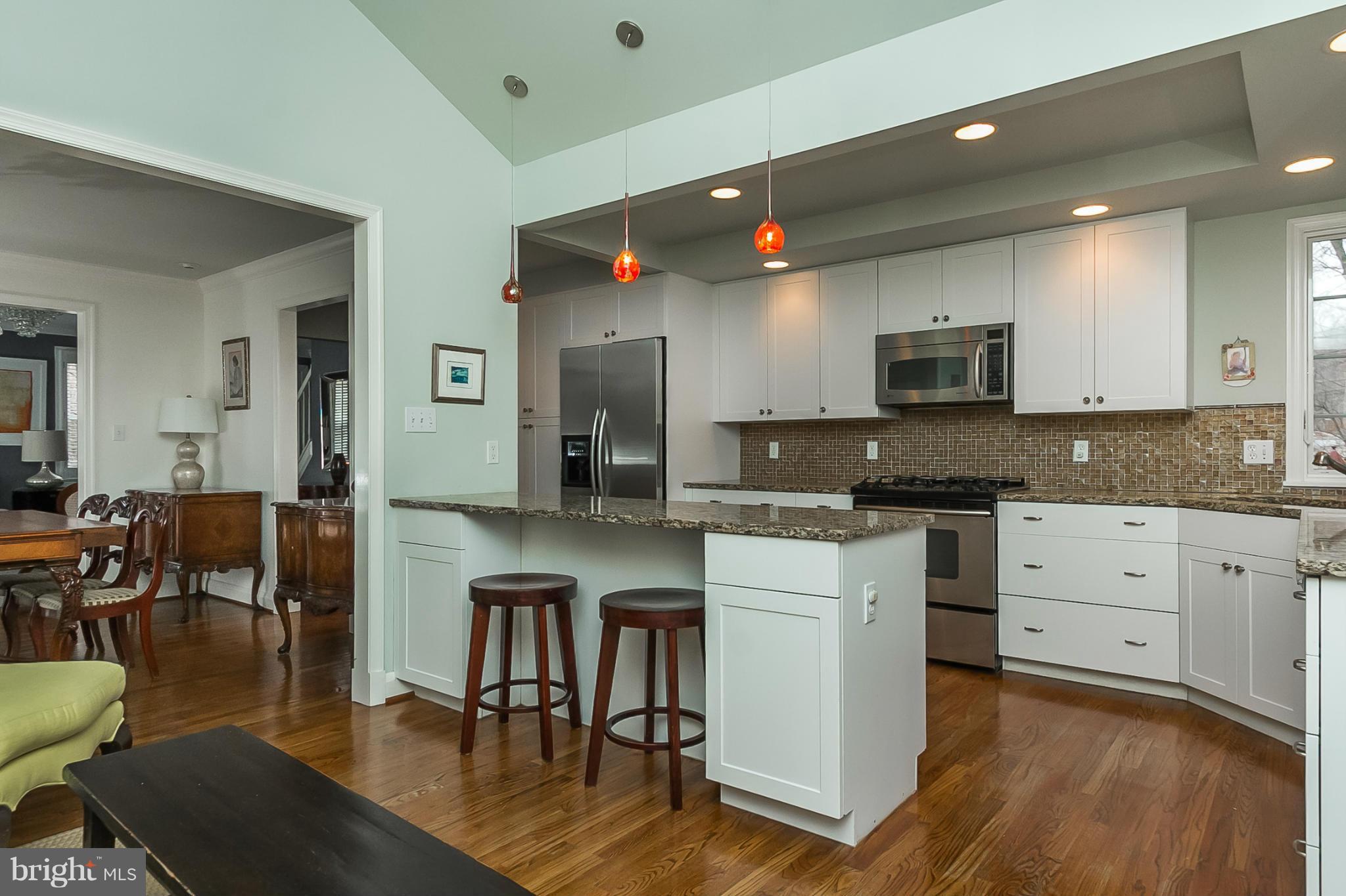 1908 Fairbank Road Baltimore, MD 21209 - Photo 11 of 27 a kitchen with stainless steel appliances a microwave a stove a sink a refrigerator and cabinets