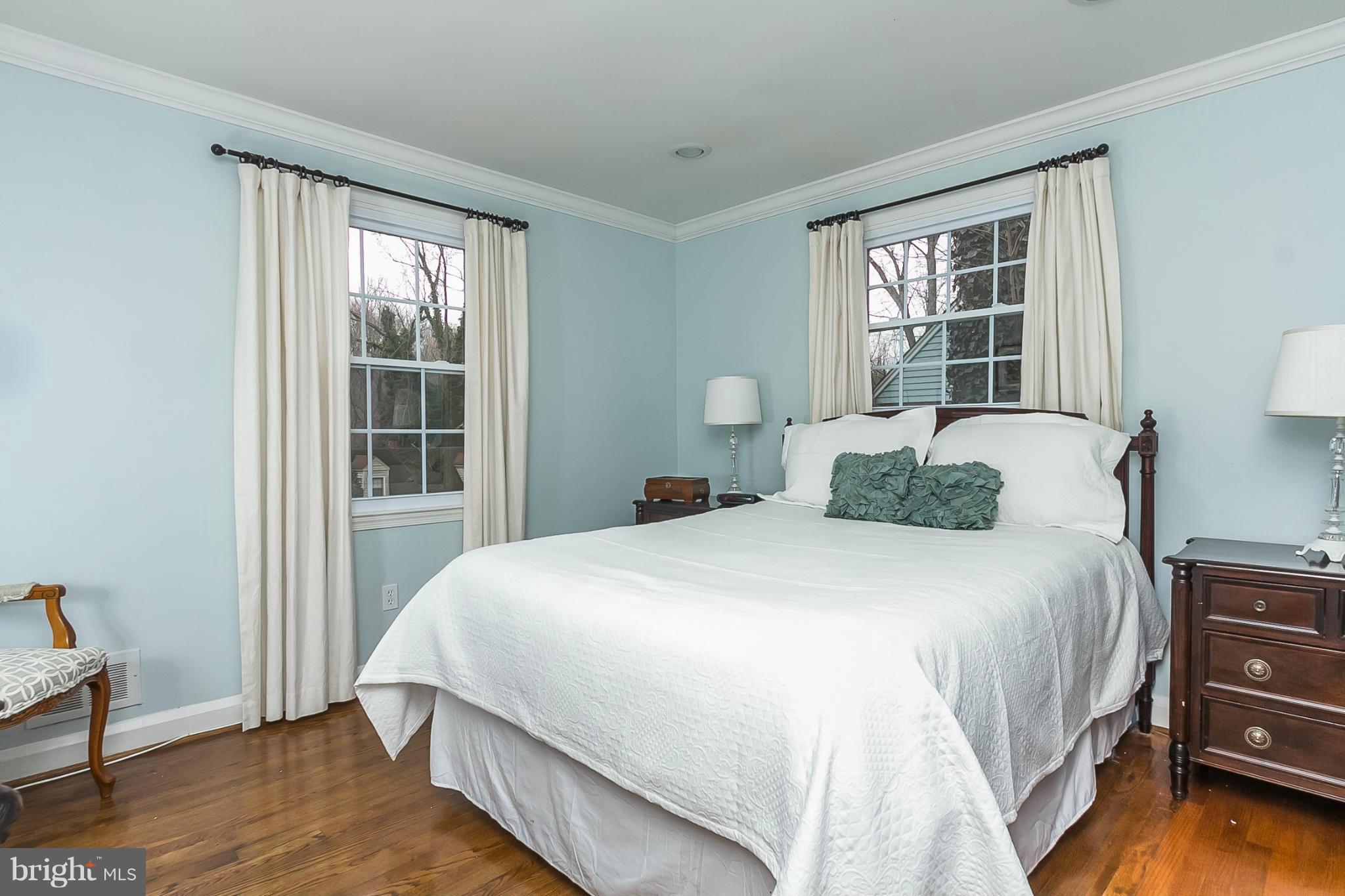 1908 Fairbank Road Baltimore, MD 21209 - Photo 12 of 27 a bedroom with a bed and a window