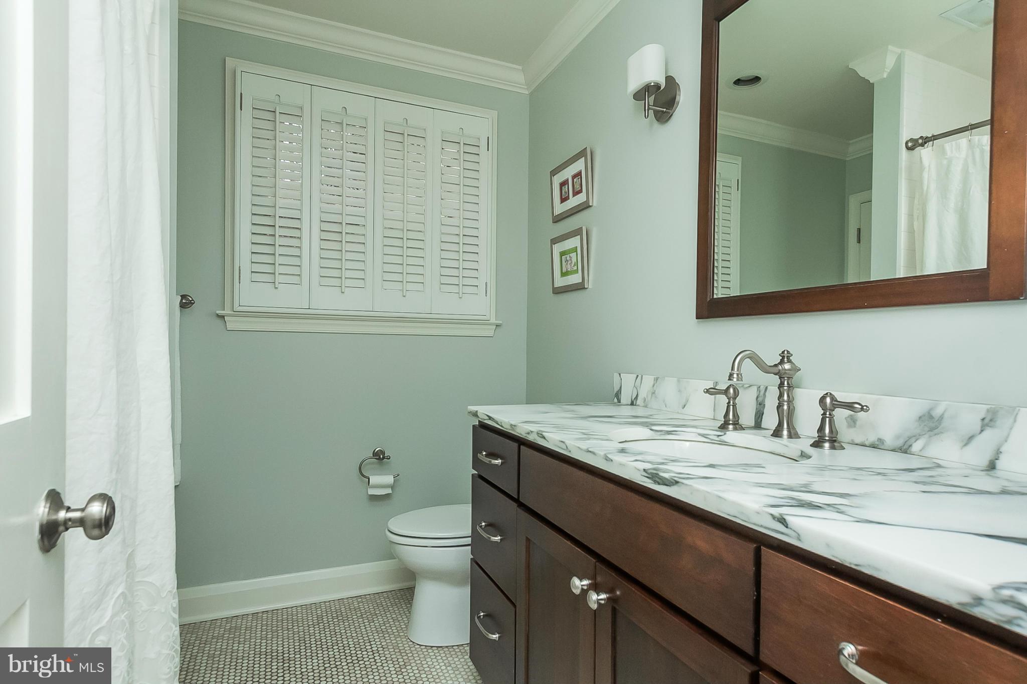 1908 Fairbank Road Baltimore, MD 21209 - Photo 15 of 27 a bathroom with a granite countertop sink toilet and shower