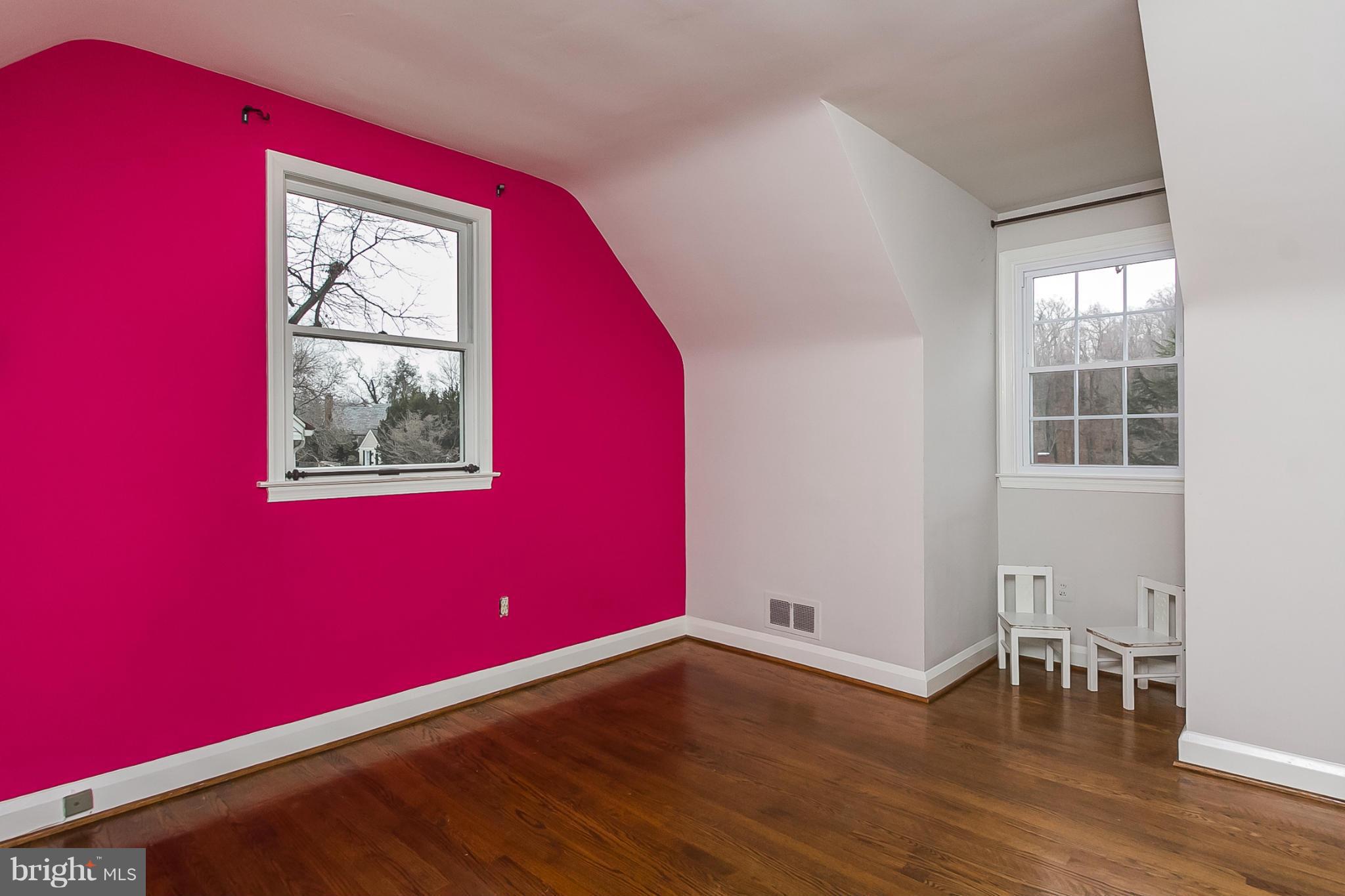 1908 Fairbank Road Baltimore, MD 21209 - Photo 18 of 27 a view of an empty room with wooden floor and a window