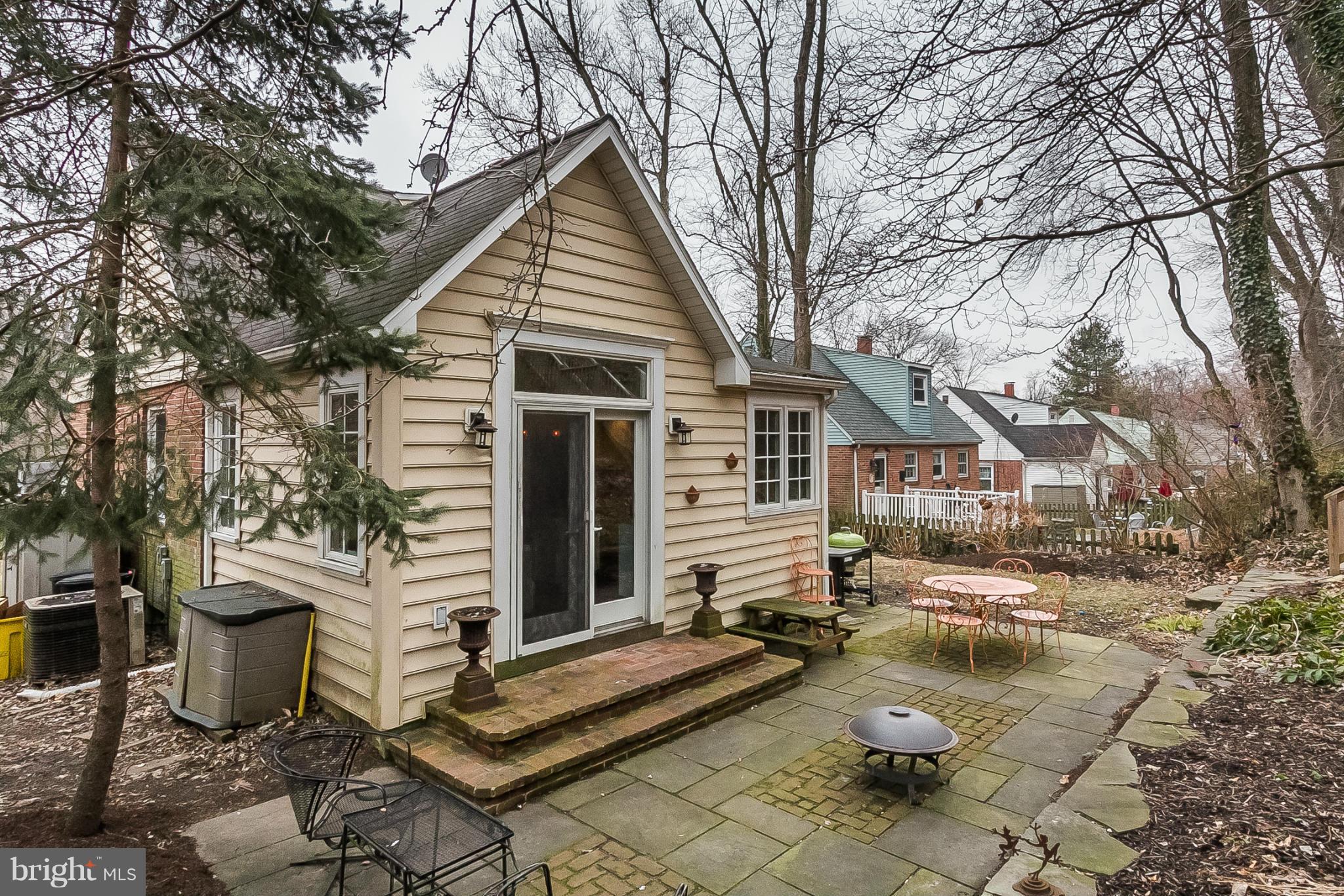 1908 Fairbank Road Baltimore, MD 21209 - Photo 24 of 27 a view of a white house with a yard and sitting area