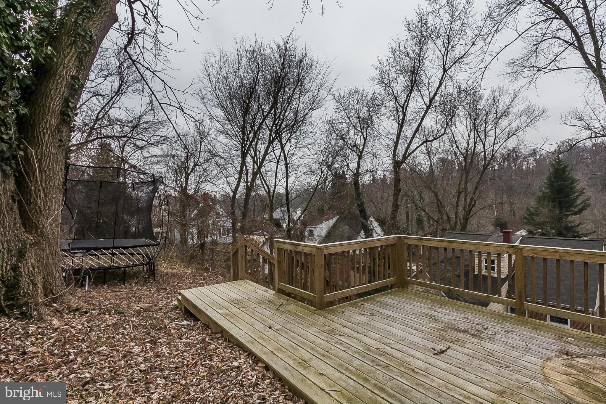 1908 Fairbank Road Baltimore, MD 21209 - Photo 26 of 27 a view of a roof deck with wooden floor and fence