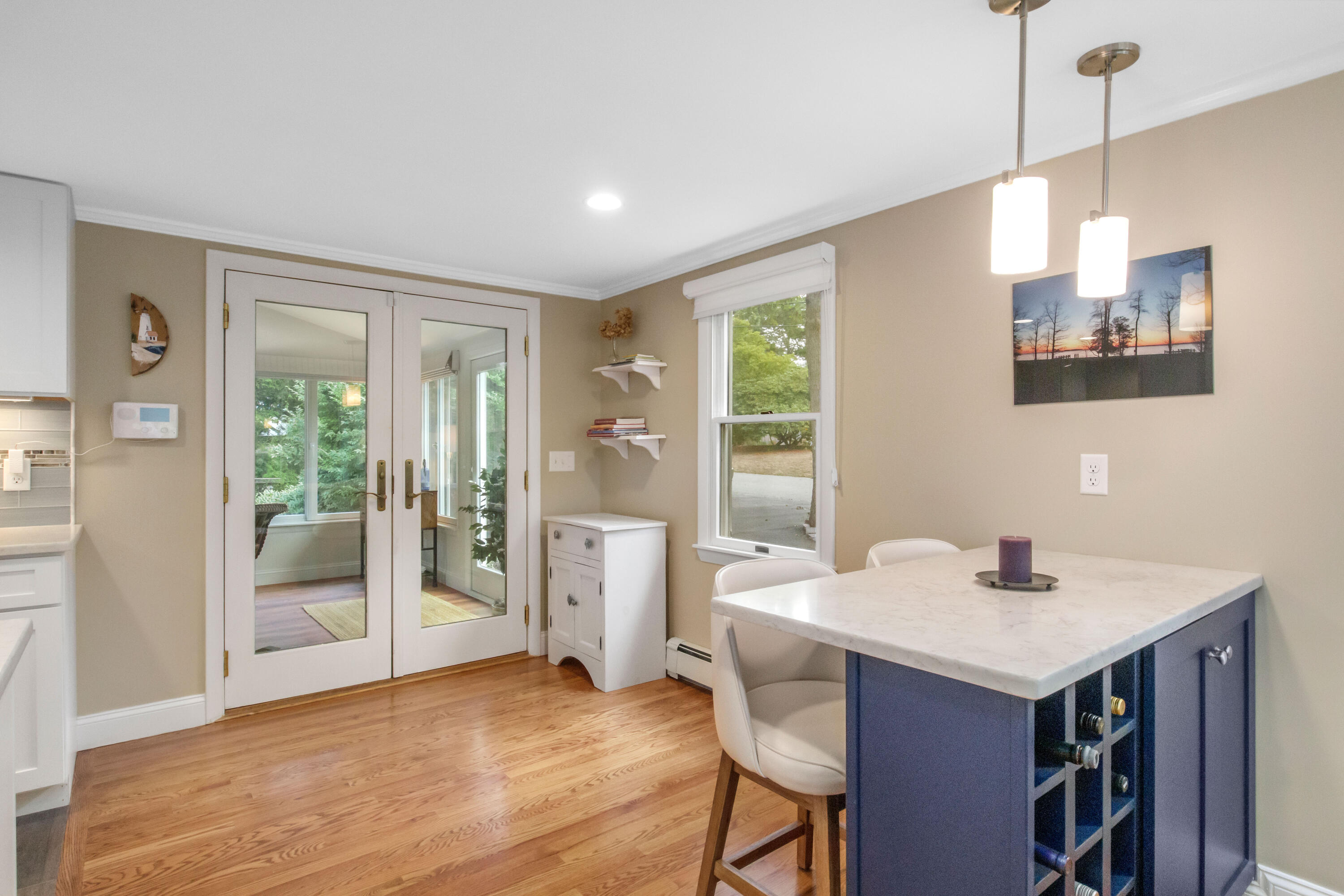 306 Old Queen Anne Road Chatham, MA 02633 - Photo 15 of 41 a kitchen that has a sink a window and chairs in it
