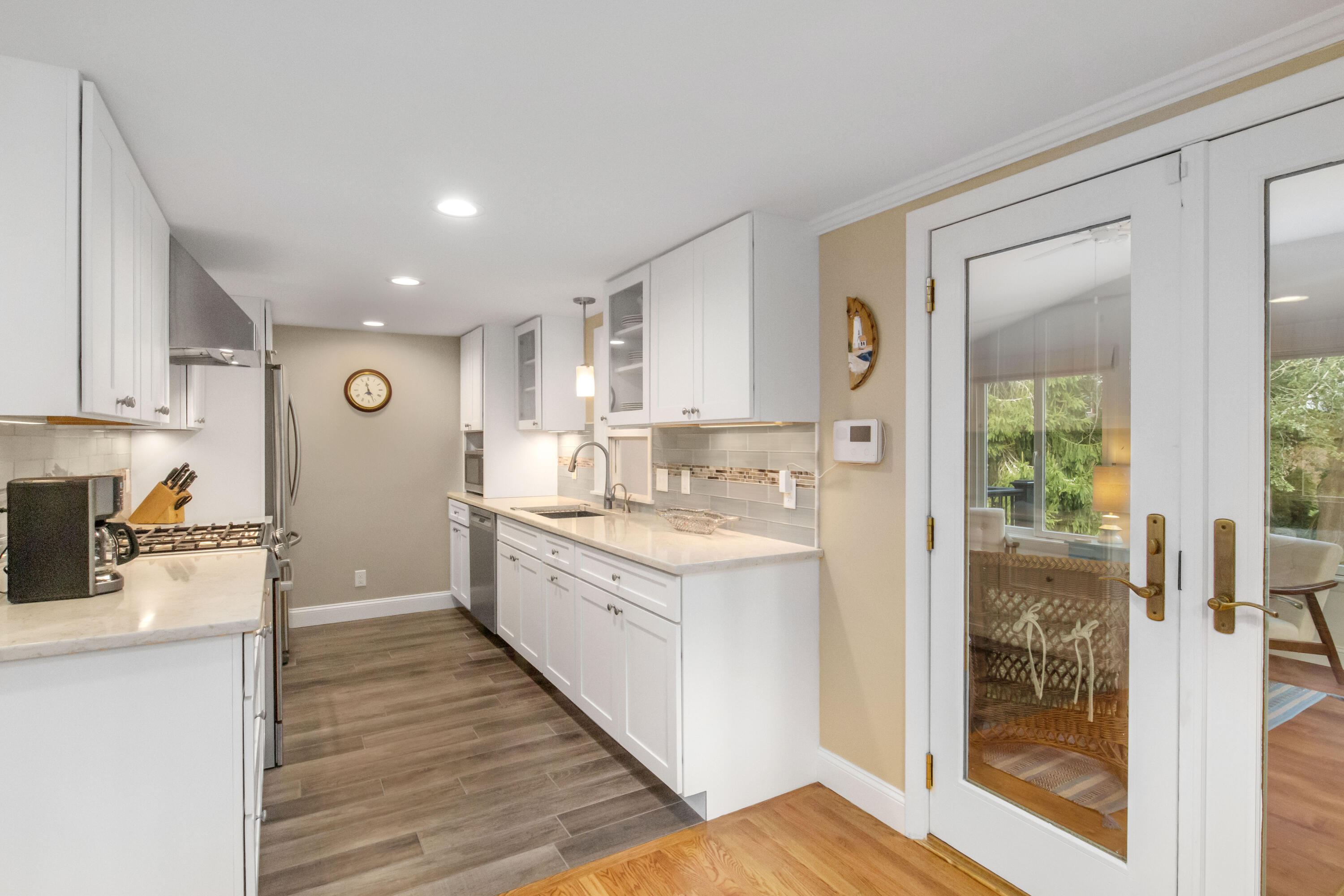 306 Old Queen Anne Road Chatham, MA 02633 - Photo 16 of 41 a kitchen with a sink appliances cabinets and a counter top space