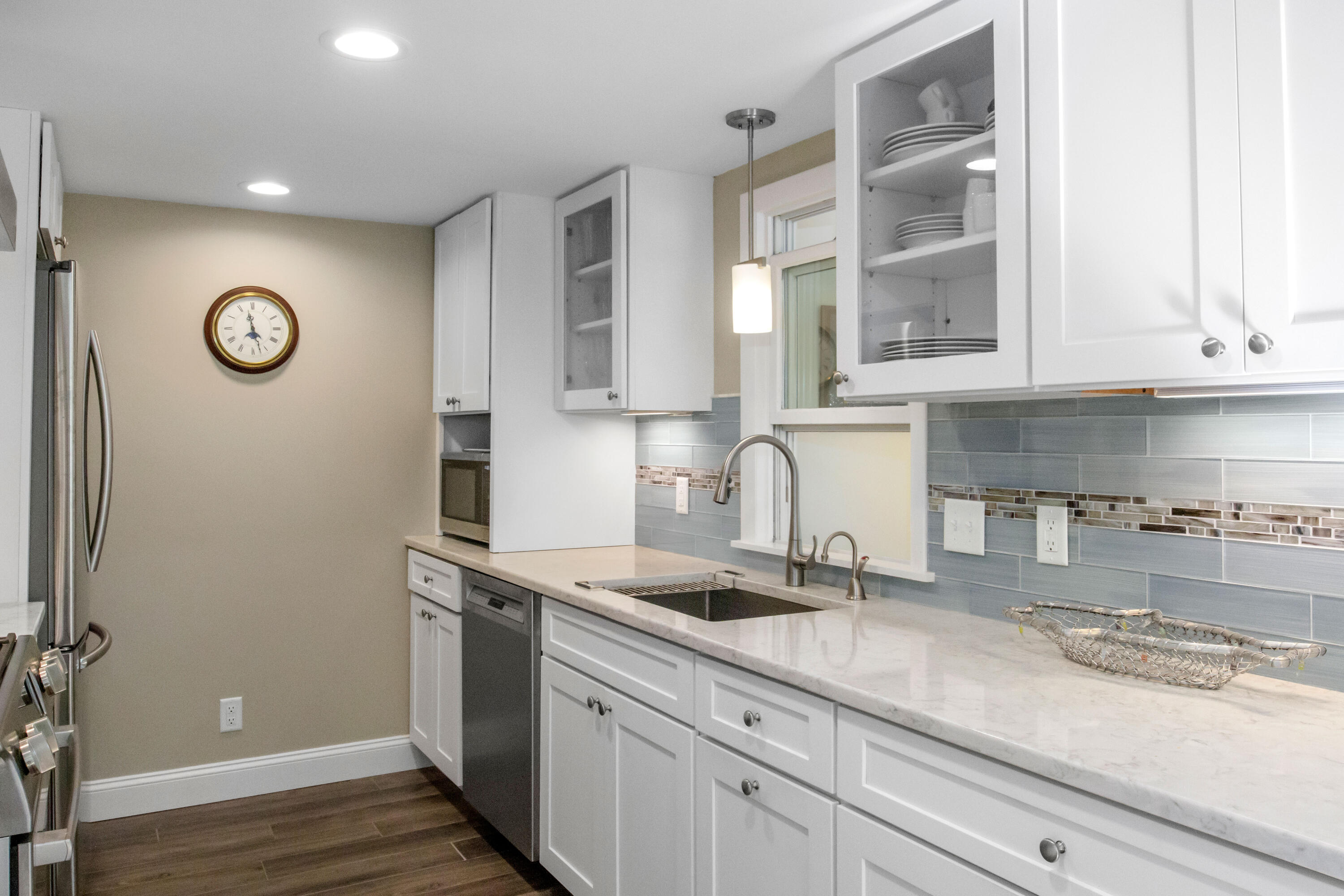 306 Old Queen Anne Road Chatham, MA 02633 - Photo 18 of 41 a kitchen with granite countertop a sink and cabinets