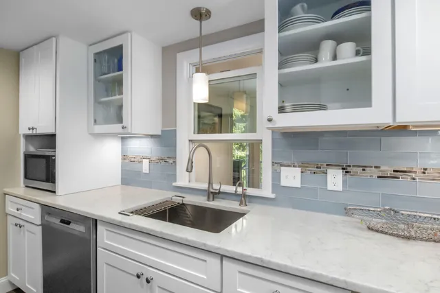 a kitchen with a sink and cabinets