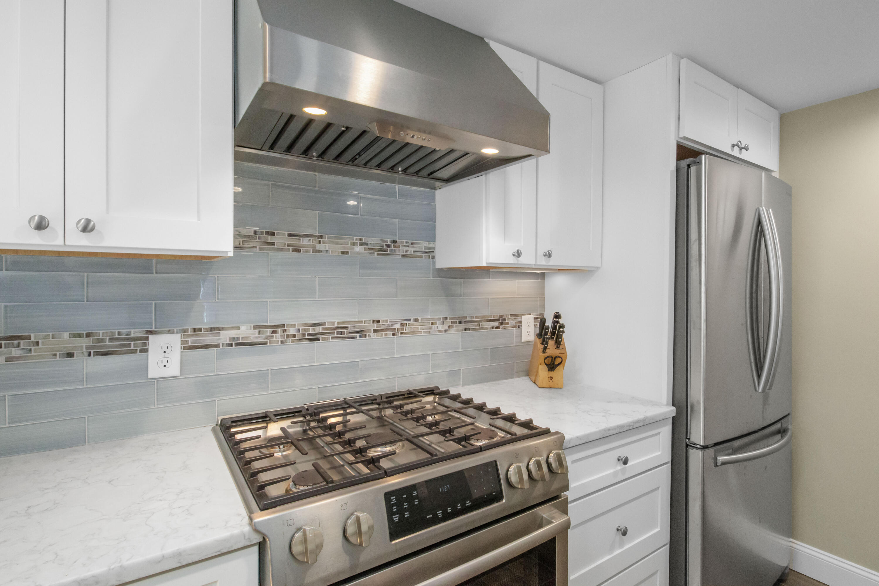 306 Old Queen Anne Road Chatham, MA 02633 - Photo 21 of 41 a kitchen with stainless steel appliances granite countertop a sink stove and refrigerator