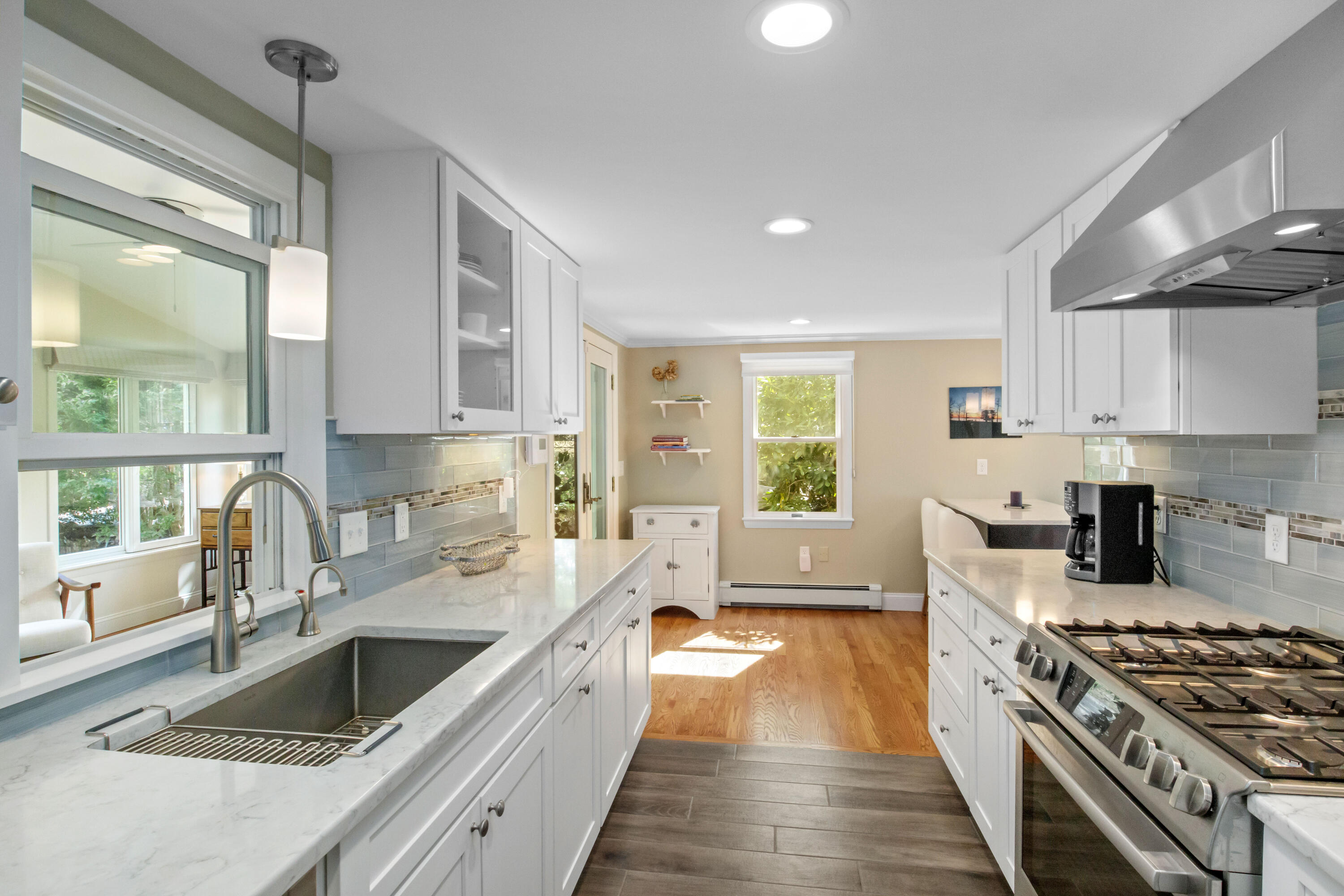 306 Old Queen Anne Road Chatham, MA 02633 - Photo 22 of 41 a kitchen with stainless steel appliances granite countertop a sink stove and refrigerator