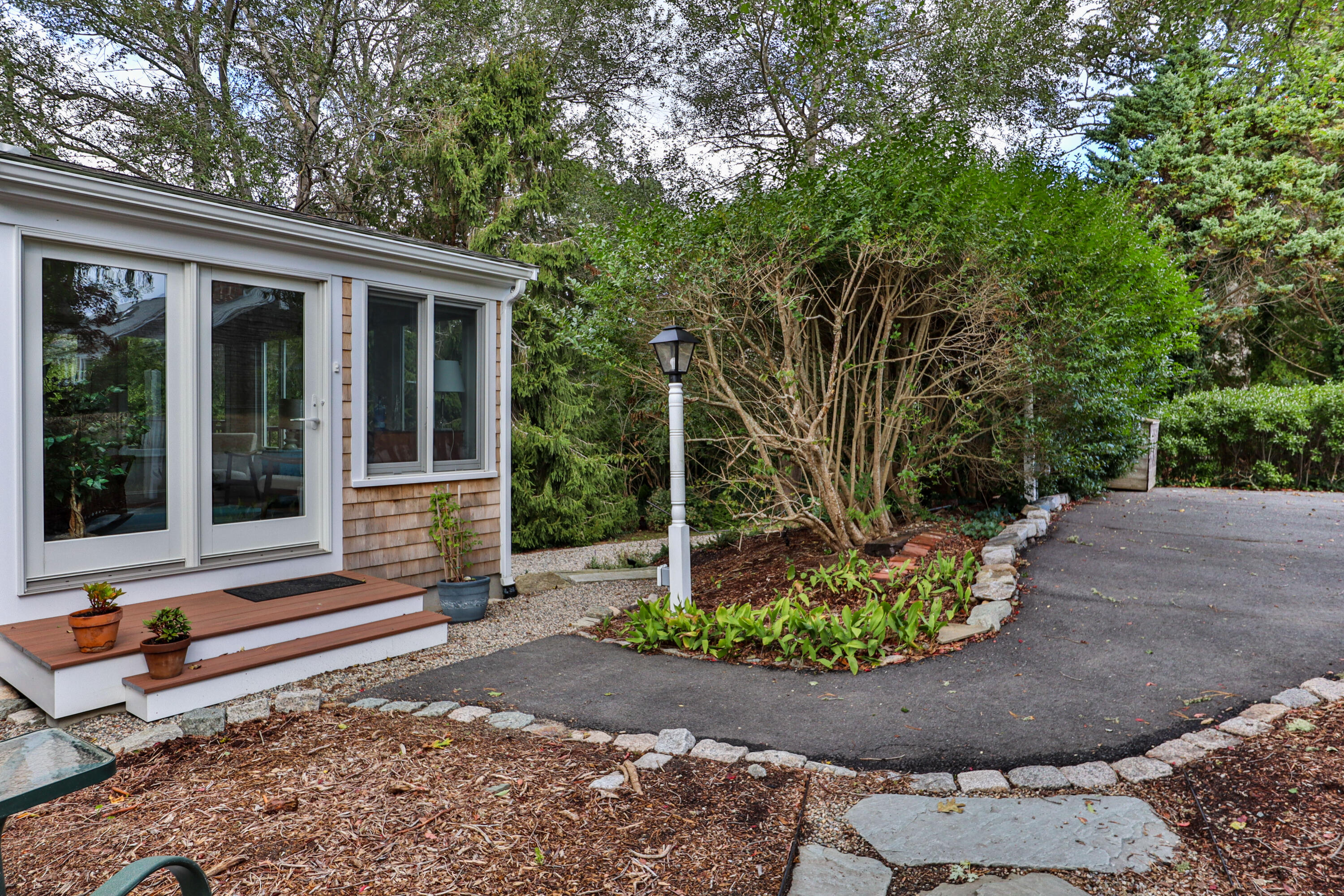 306 Old Queen Anne Road Chatham, MA 02633 - Photo 3 of 41 a backyard of a house with lots of green space