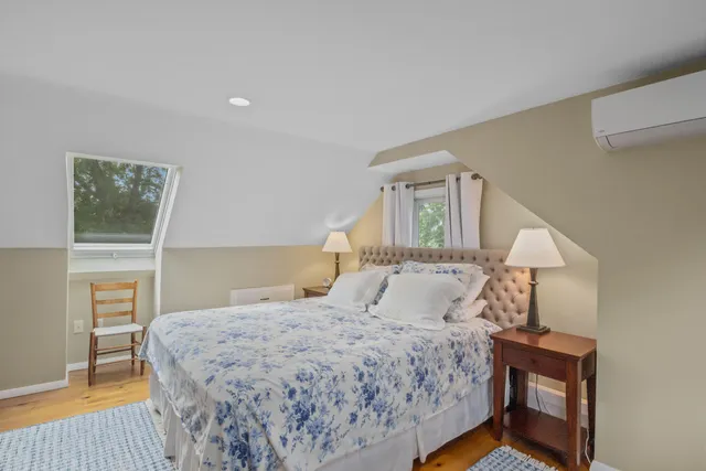 a bedroom with a bed and a mirror