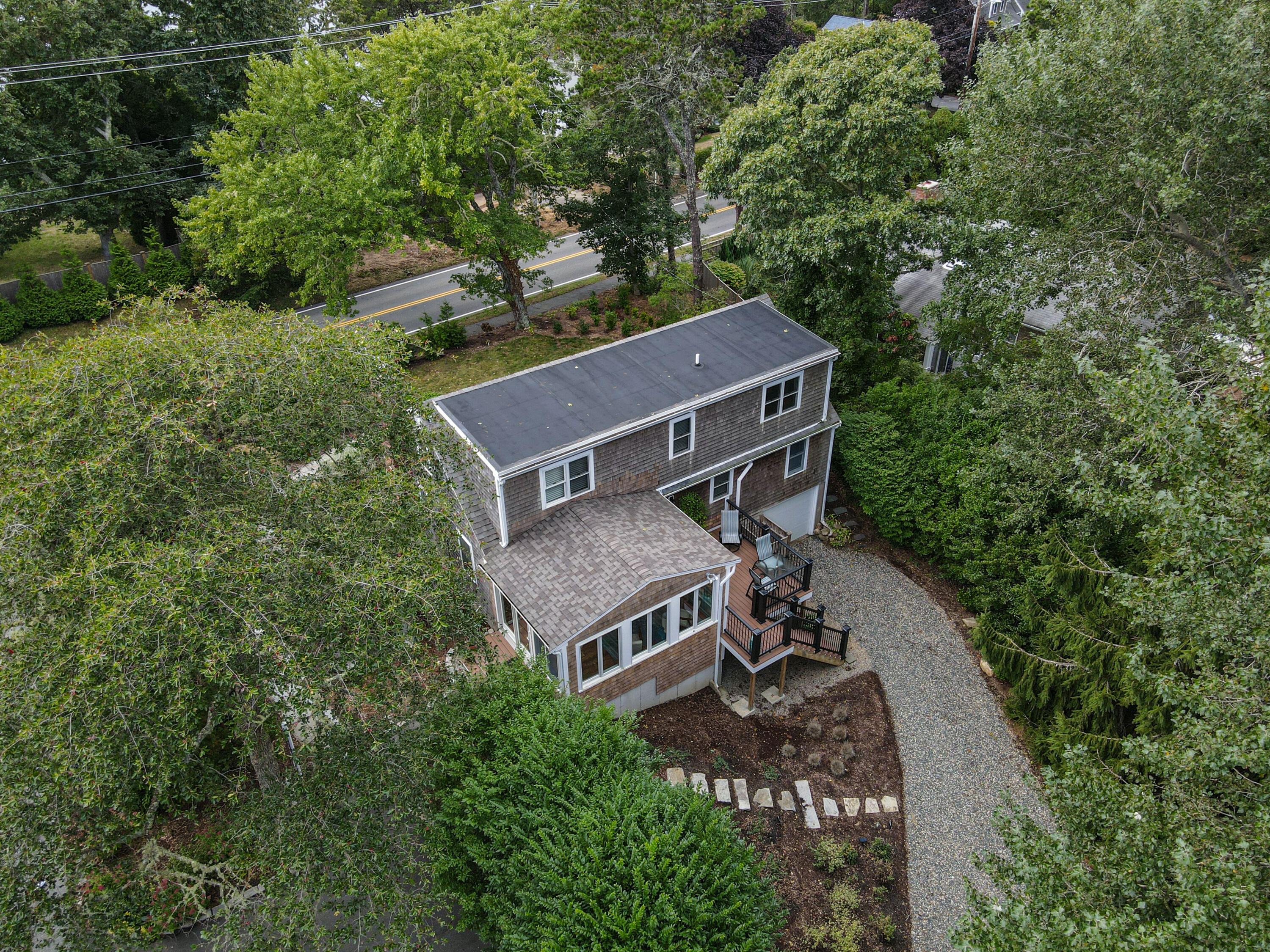 306 Old Queen Anne Road Chatham, MA 02633 - Photo 36 of 41 an aerial view of a house with a big yard