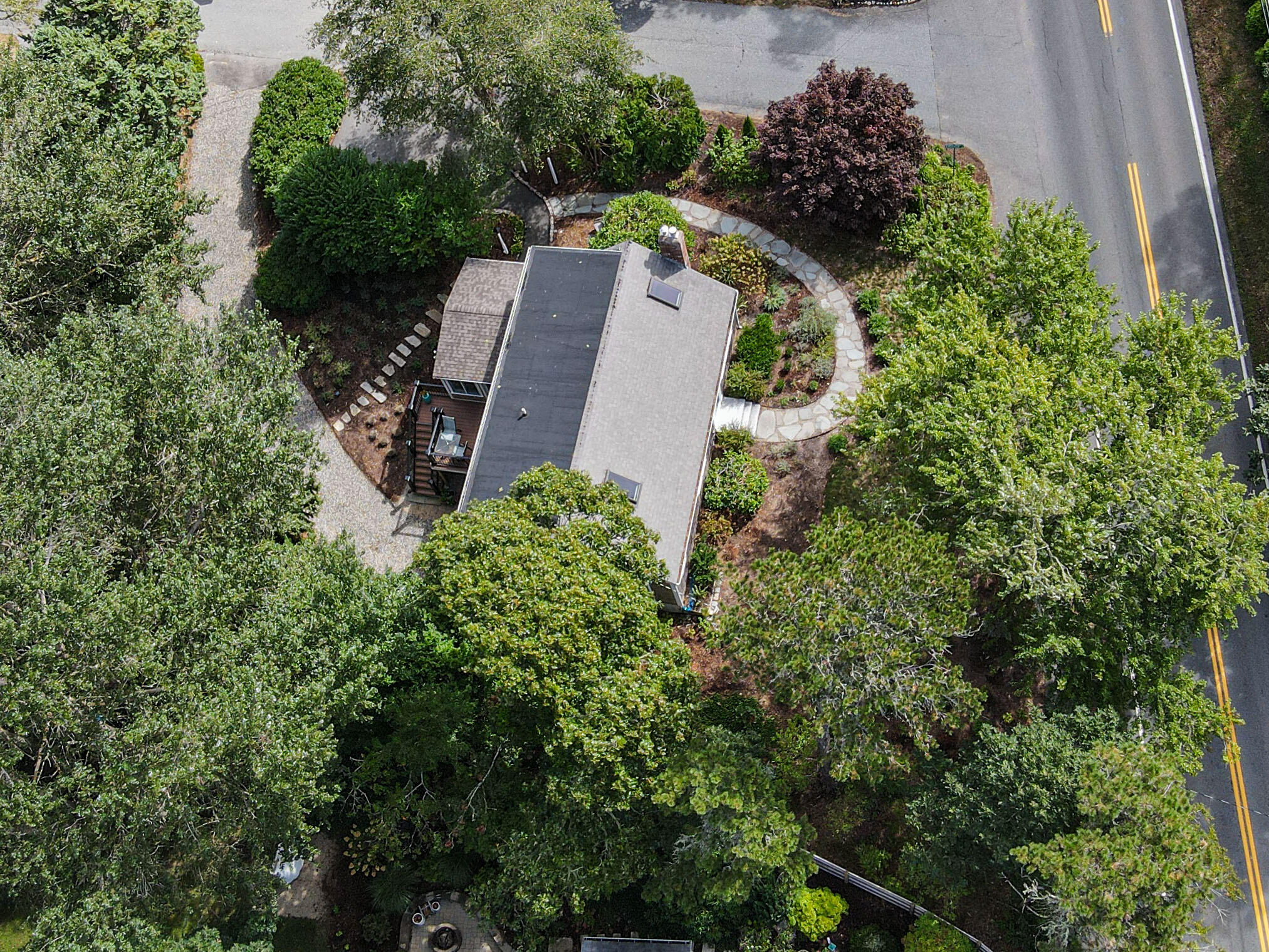 306 Old Queen Anne Road Chatham, MA 02633 - Photo 38 of 41 an aerial view of a house with a yard and trees all around