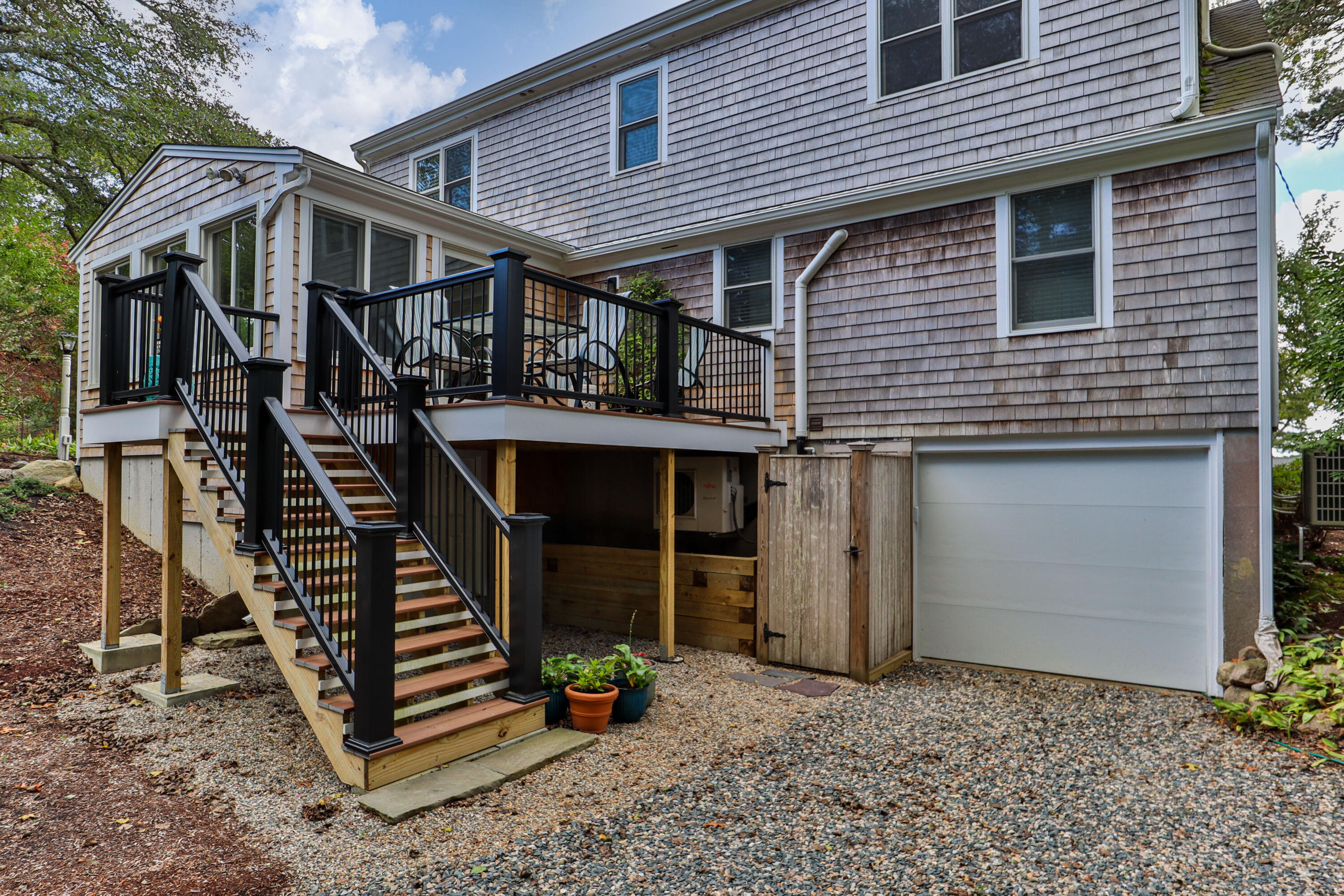 306 Old Queen Anne Road Chatham, MA 02633 - Photo 4 of 41 a front view of a house with wooden fence