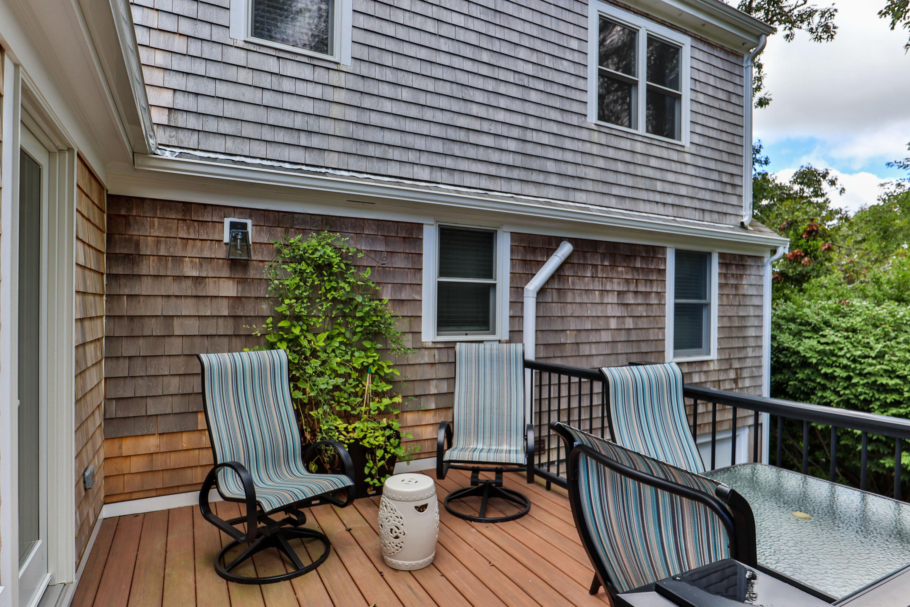306 Old Queen Anne Road Chatham, MA 02633 - Photo 6 of 41 a view of a chair and table in the balcony