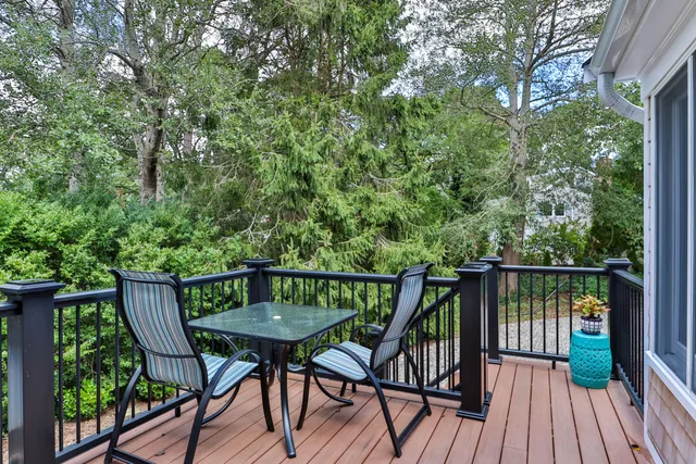 a view of a balcony with furniture