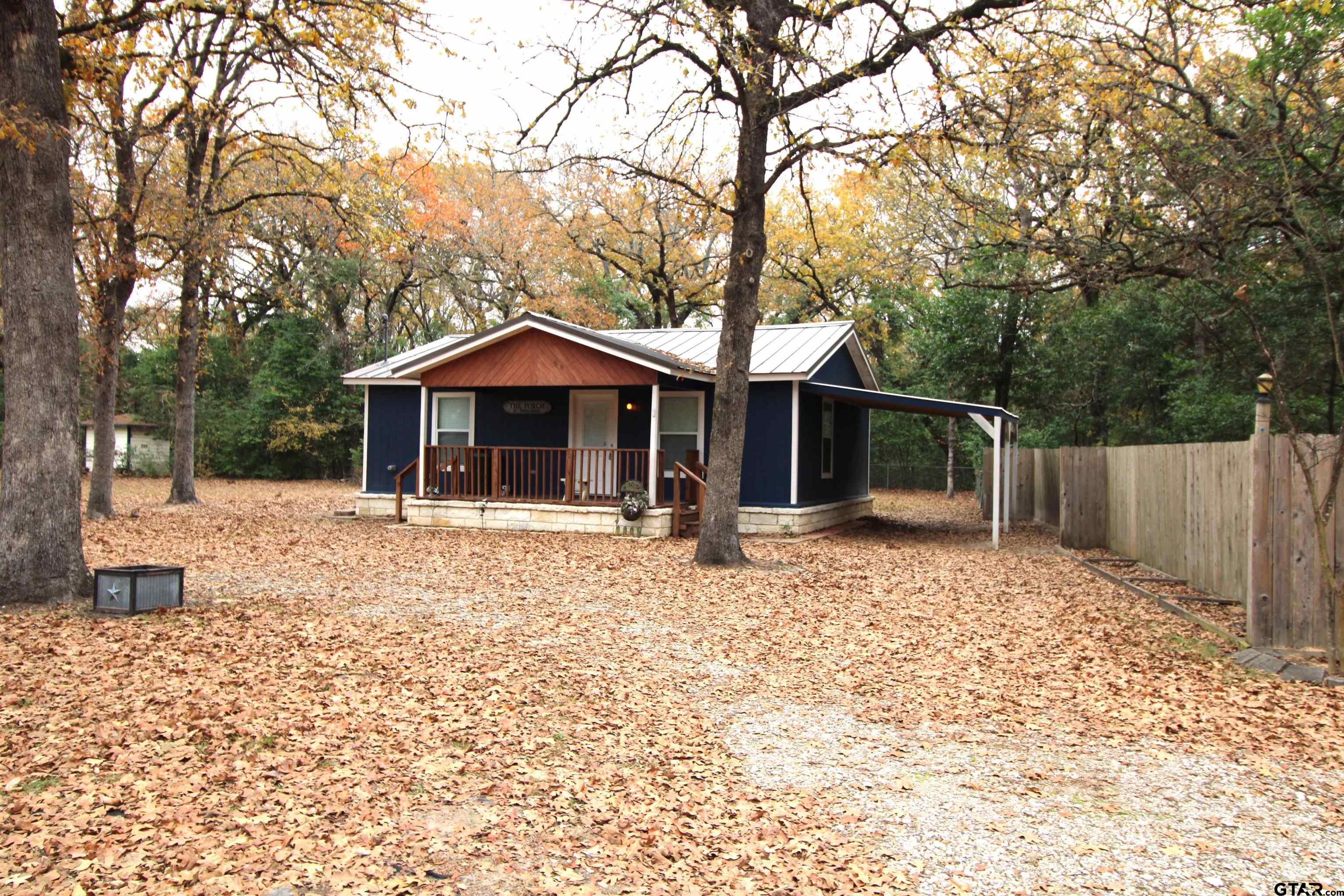 136 Long Shadow Drive Murchison, TX 75778 - Photo 2 of 19 a front view of a house with garden