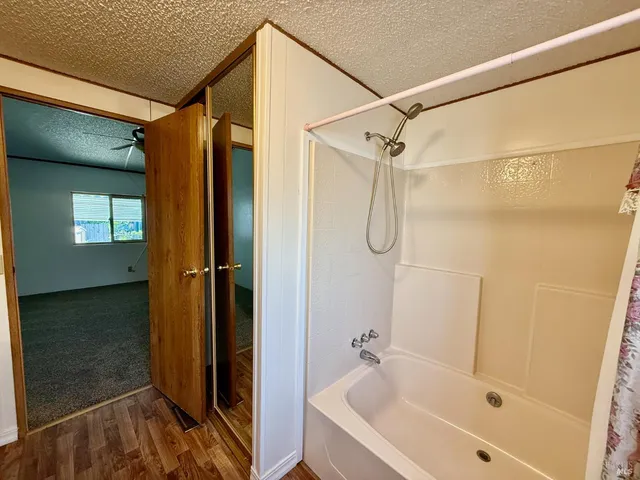 a bathroom with a glass shower door and a sink