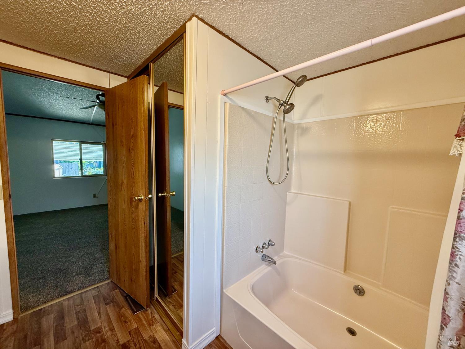 8148 D Street Windsor, CA 95492 - Photo 23 of 30 a bathroom with a glass shower door and a sink