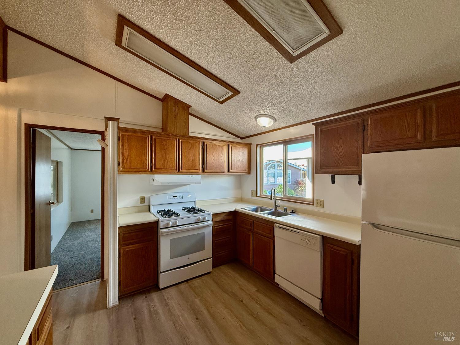 8148 D Street Windsor, CA 95492 - Photo 9 of 30 a kitchen with stainless steel appliances granite countertop a stove a sink dishwasher and a refrigerator