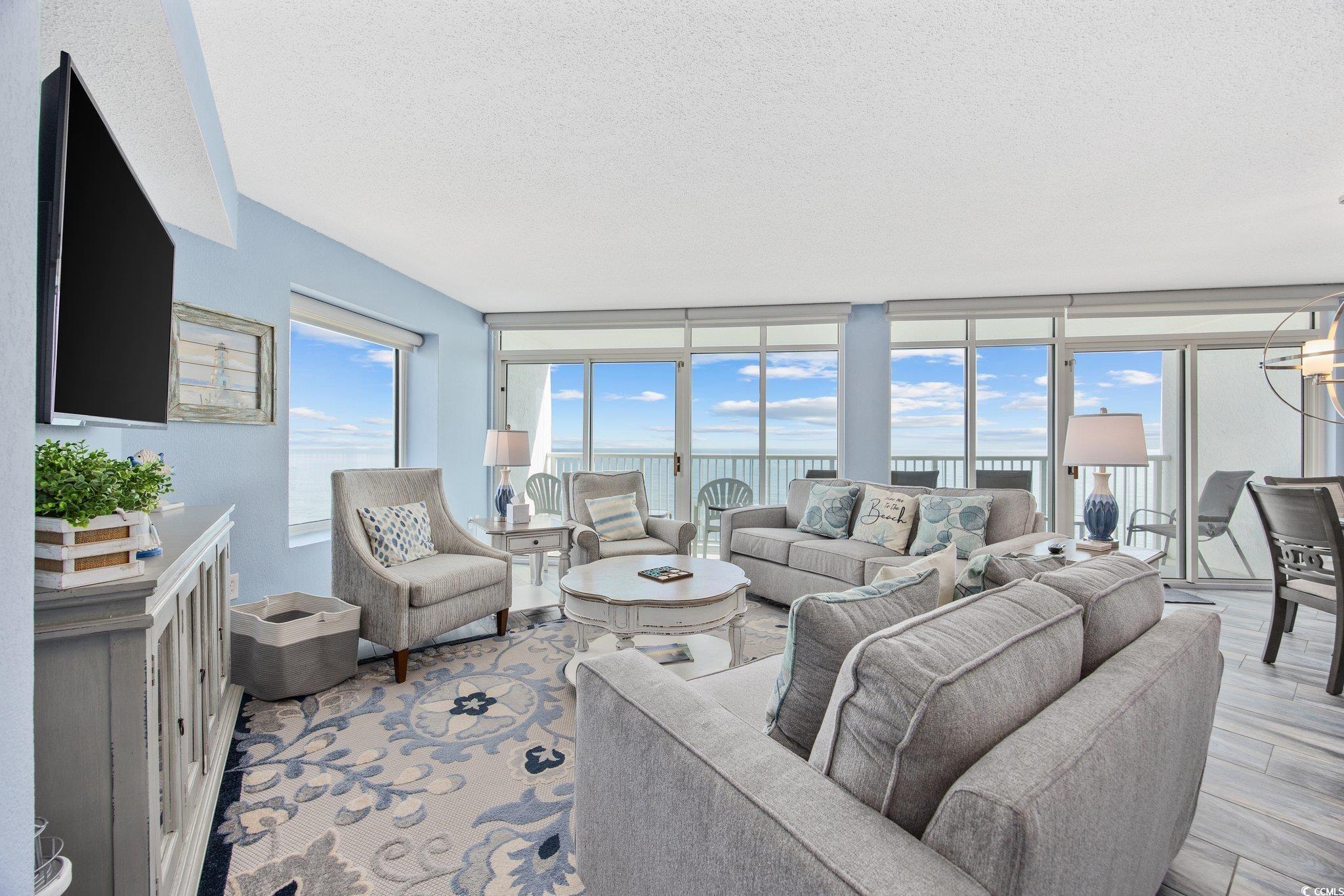 161 Seawatch Drive, Unit 1117 Myrtle Beach, SC 29572 - Photo 12 of 33 Living area featuring a textured ceiling, a water