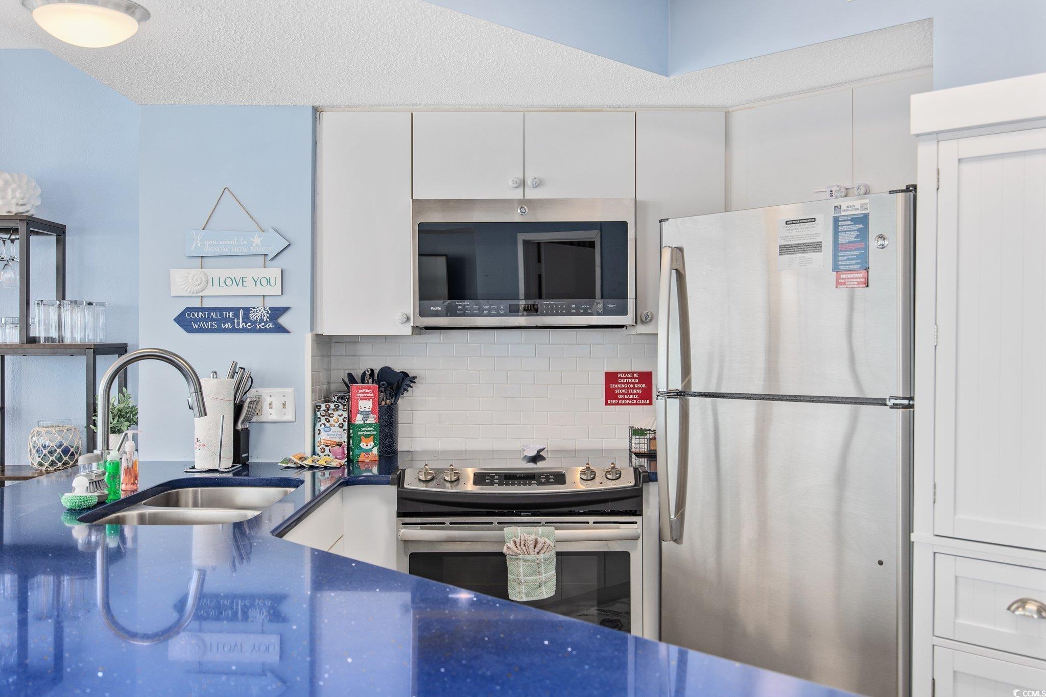 161 Seawatch Drive, Unit 1117 Myrtle Beach, SC 29572 - Photo 17 of 33 Kitchen featuring stainless steel appliances, tast