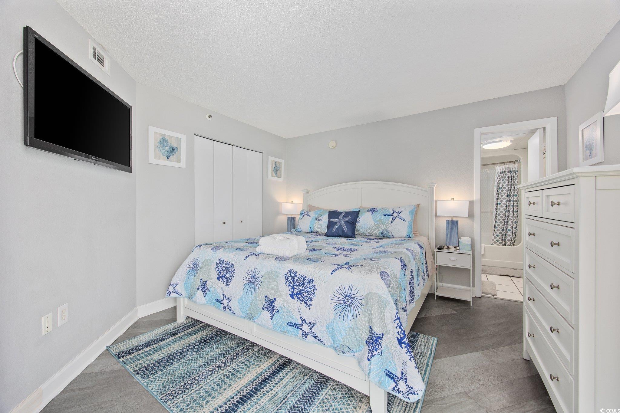 161 Seawatch Drive, Unit 1117 Myrtle Beach, SC 29572 - Photo 24 of 33 Bedroom with baseboards and a closet